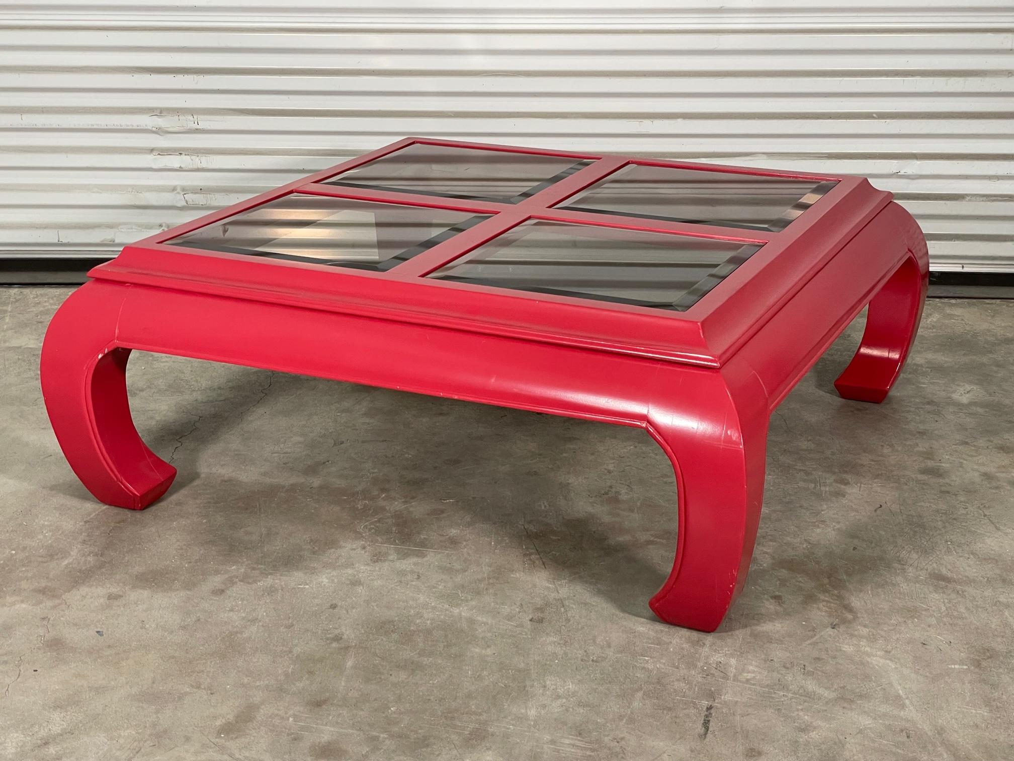 Ming Asian style coffee table features smoked beveled glass inserts and red high gloss lacquer finish. Good condition with minor imperfections to the newly lacquered finish, see photos for condition details.

