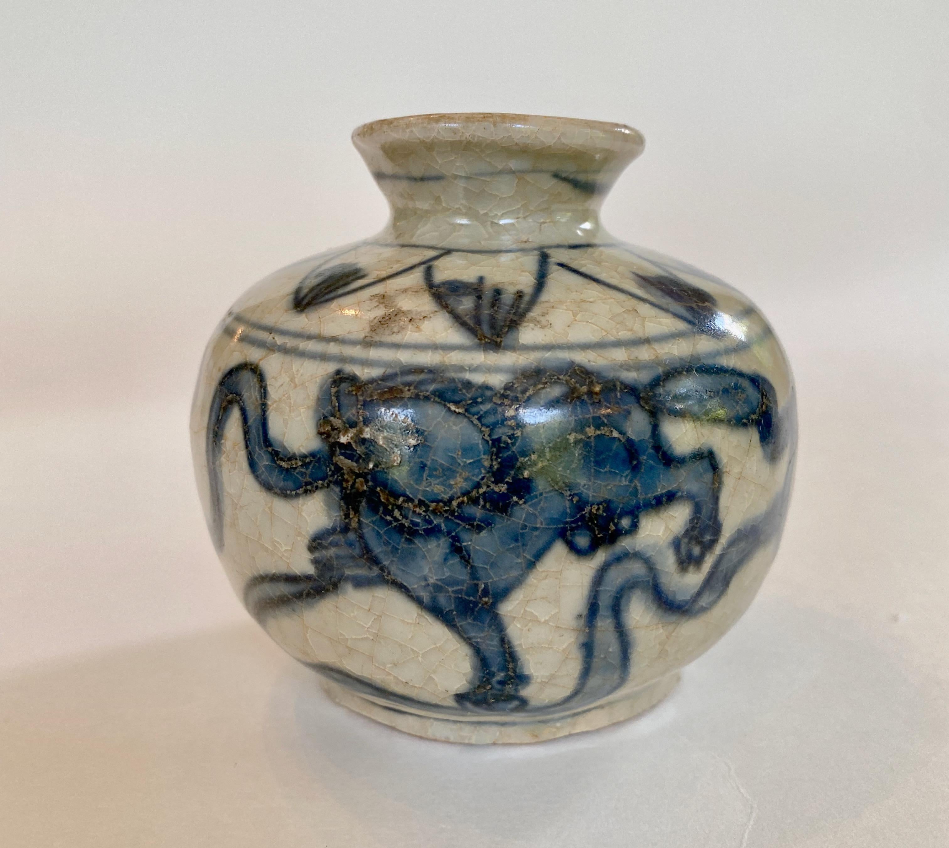Ming dynasty blue and white jarlet decorated with lions, 16th century. 
This jarlet of deep cobalt blue on an off-white, almost bisque, background has an attractive crackled glaze and a kinetic design. The decoration represents two romping lions