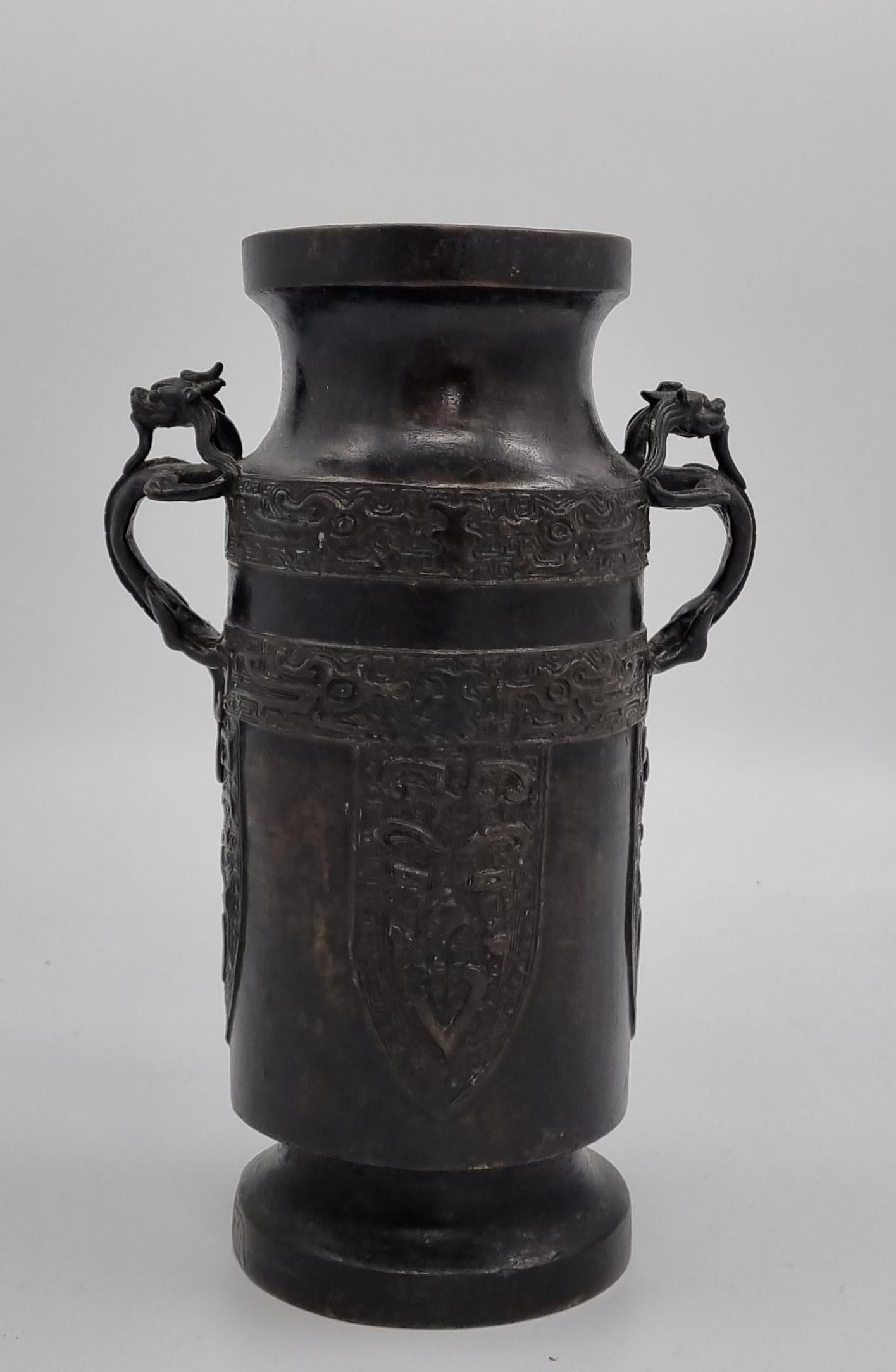 Chinese Ming dynasty bronze vase ( 1368- 1644 ) A genuine Ming vase dating from the early to middle of the ming dynasty. Archaistic decoration Taotie  mask design handles and Taotie  (