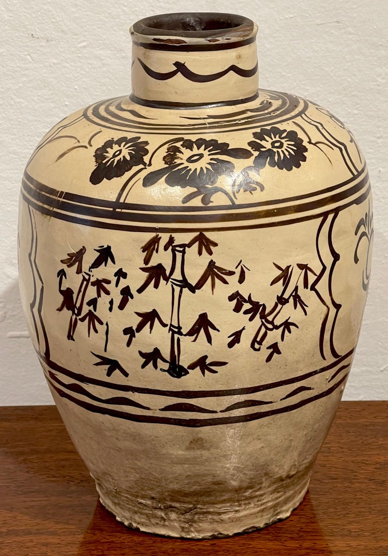 Ming Dynasty Cizhou Stoneware 'Flowers & Bamboo' Vase #2*
China, circa 17th Century or older
A good example, hand decorated in typical earth-tone Chinese calligraphic palette of florals and bamboo.
This vase stands 19.75-Inches high x 12-Inch