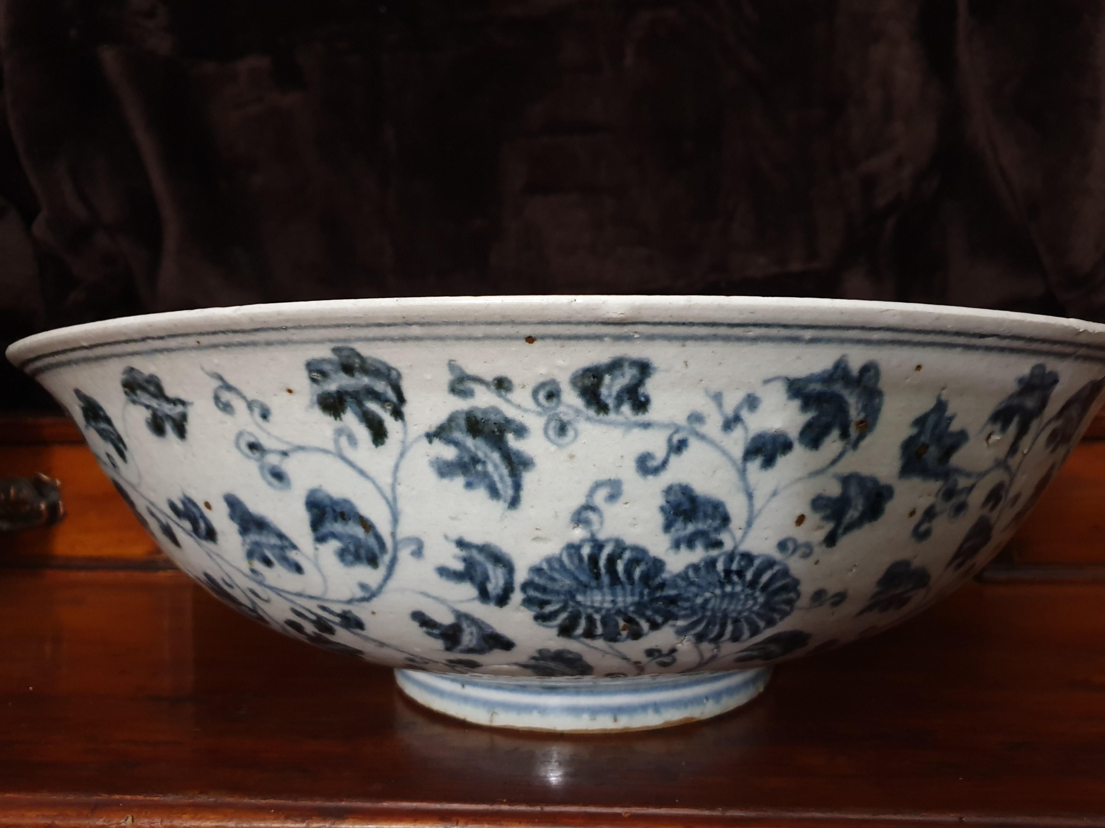 Ming dynasty blue & white large exhibition center piece Imperial Provincial bowl Yongle Pattern. The central medallion is finely painted with floral scroll including rose, hibiscus, pomegranate, lotus, peony, chrysanthemum, and camellia blossoms,