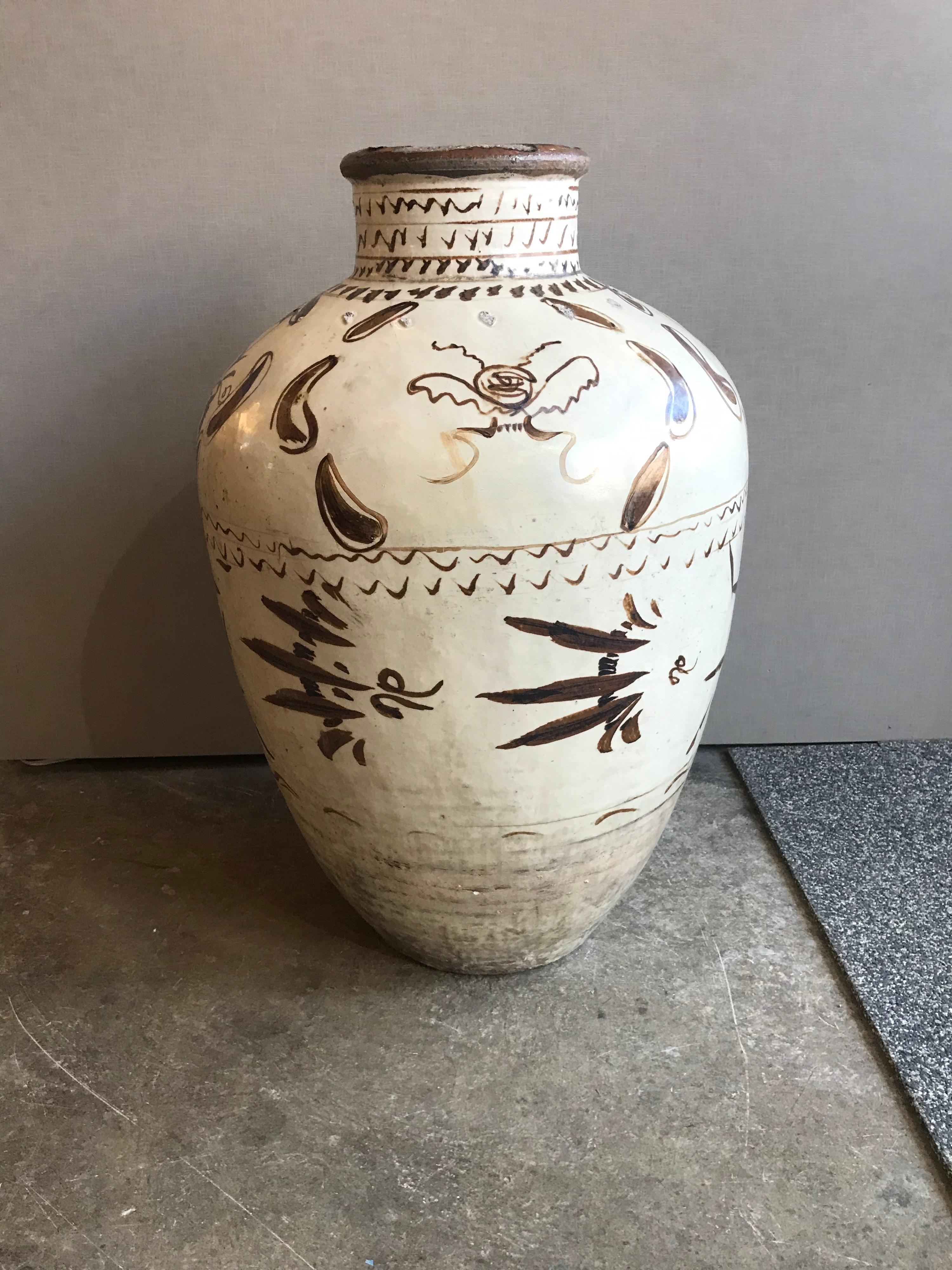 This is a lovely old Asian pot from the Ming dynasty late 16th-17th century from what i was told they were used as wine jars.