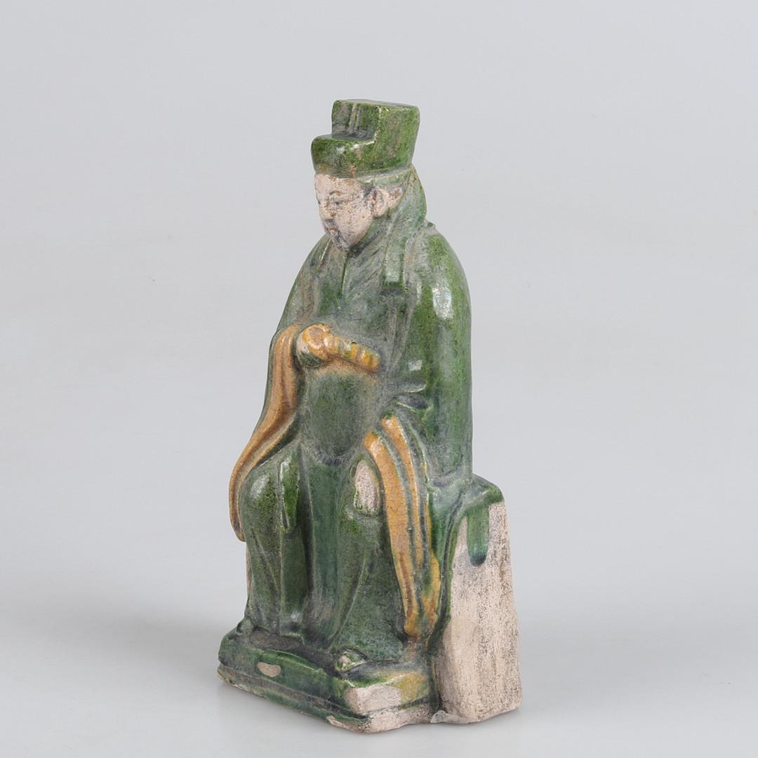 Ming Dynasty tomb statue depicting a seated Scholar. Terracotta glazed and painted in green, yellow, red and black. 

Measure: height 19.5 cm.