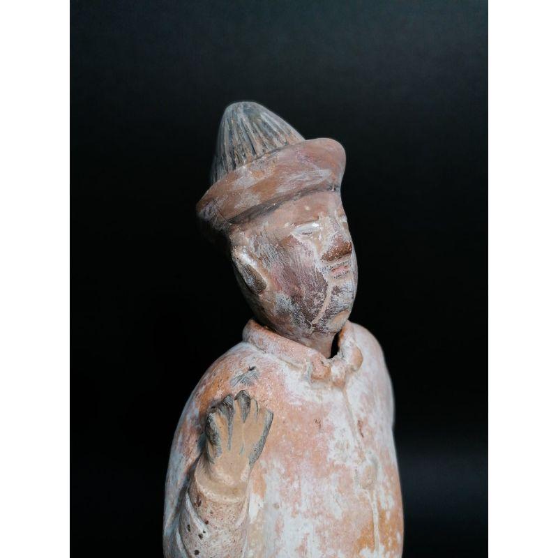 Ancient Chinese terracotta tomb sculpture depicting a servant, with removable head.
China, 17th century

Origin: China
Period: The style of the figurine and its patina allow the piece to be traced back to the late Ming dynasty, around the early