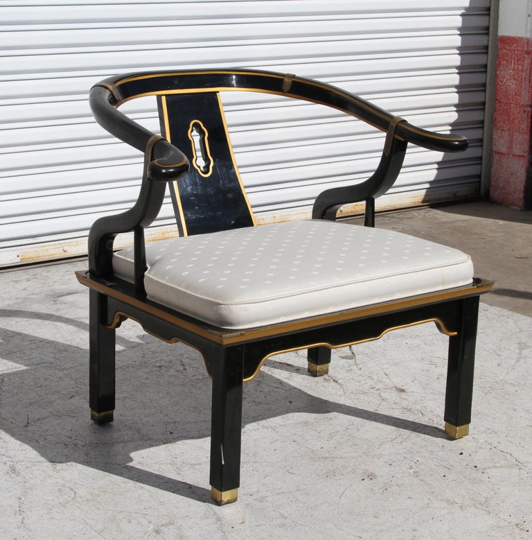 Ming style black lacquer & brass low chair after James Mont.

Ming style yoke back black lacquered low chair with square brass sabots in the style of James Mont. circa, midcentury-1970s.

Vintage Ming style low yoke back chair in the style of