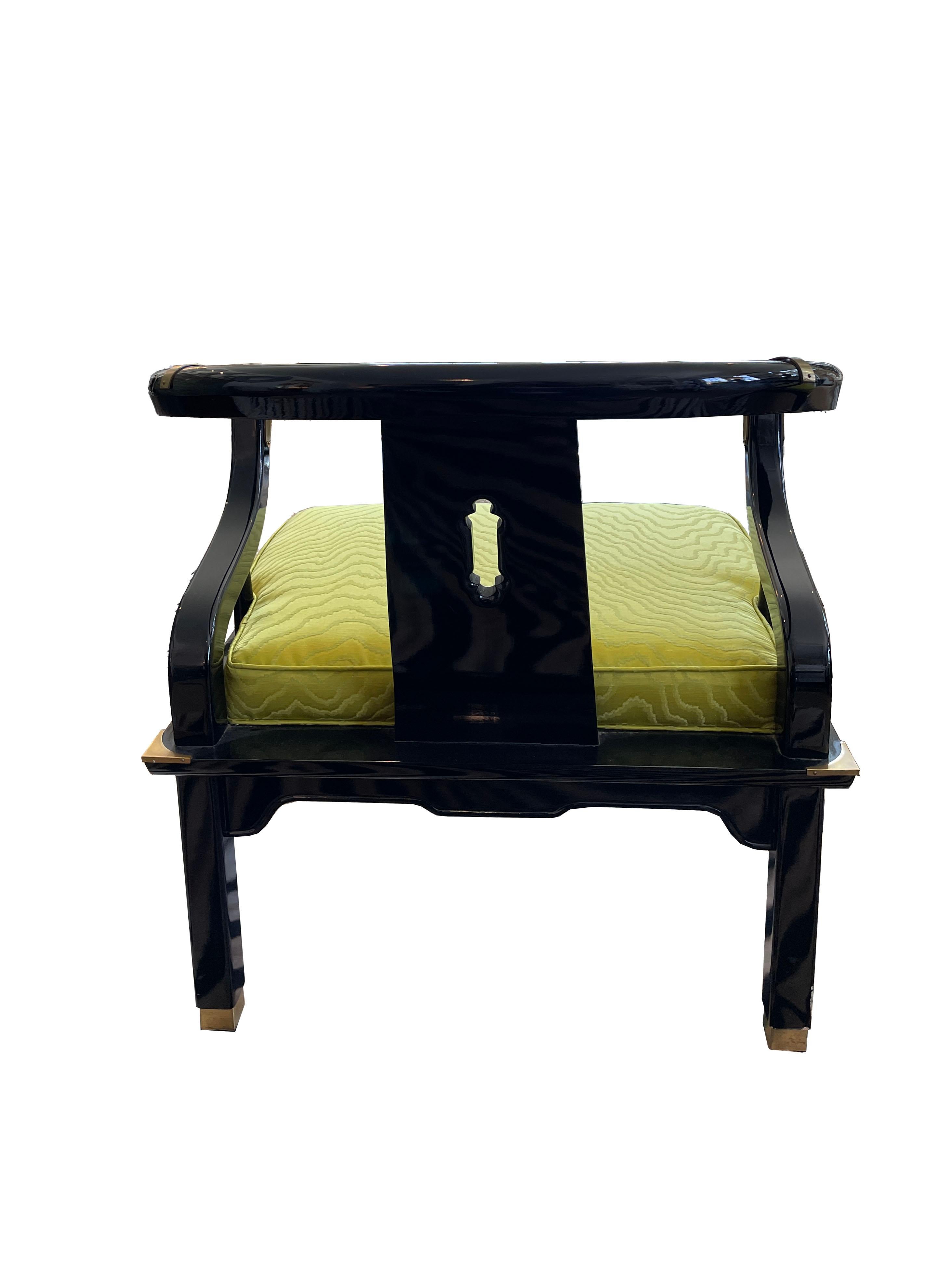 A pair of black lacquer 1960's vintage ming style chairs by James Mont for Century Furniture. These stylish and timeless chairs have been reupholstered in Kravet Faux Bois Citrine fabric. Brass Accents are original.