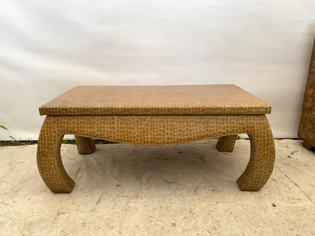 Lovely ming coffee table with traditional lines, updated with a fun and authentic vinyl alligator upholstery.
