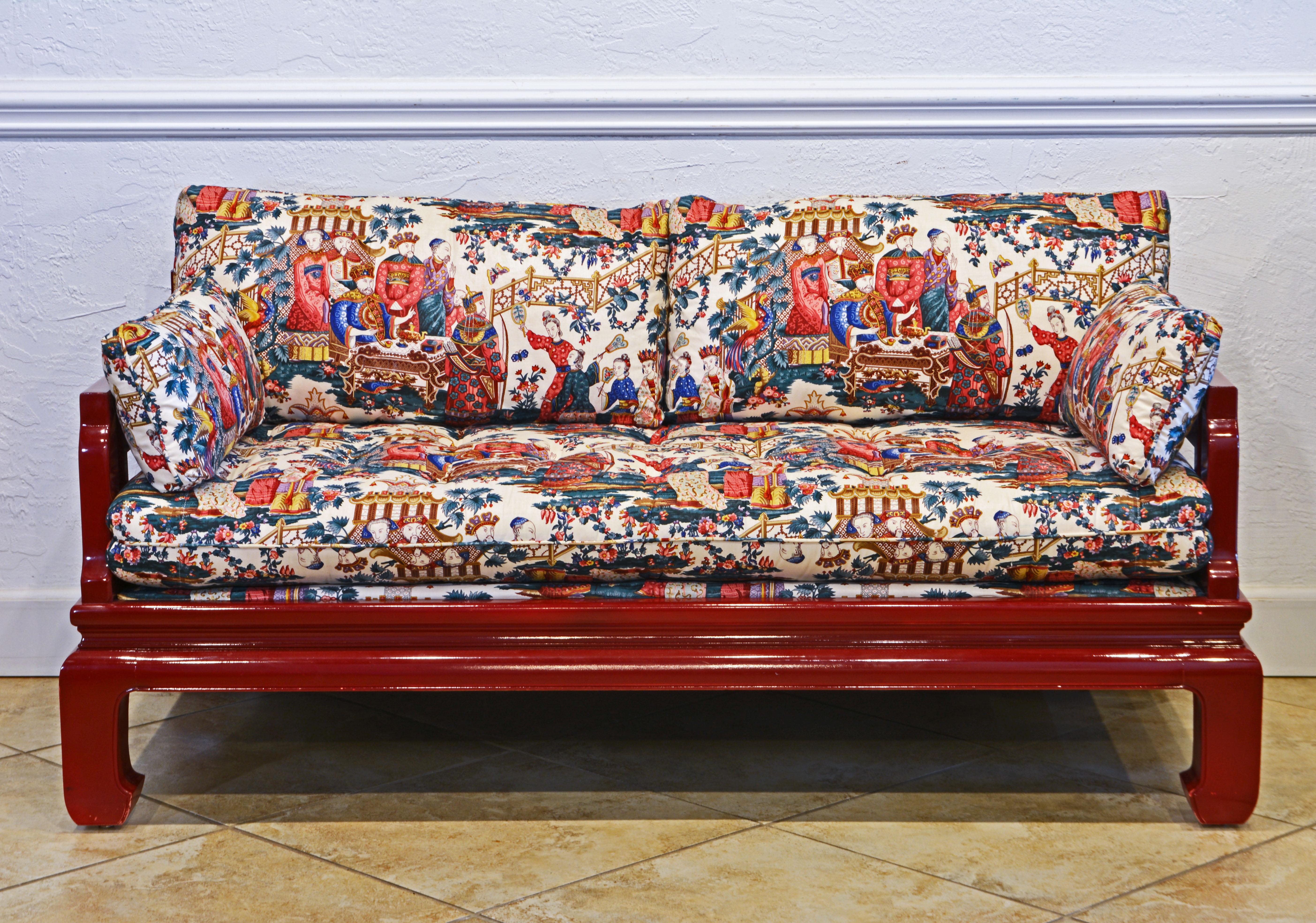 This good looking sofa adds life and a sense of joy to an interior. The red lacquered hardwood construction is fashioned in the old Chine Ming style and the first class quality upholstery and fabric with an abundance of Chinese courtiers and the