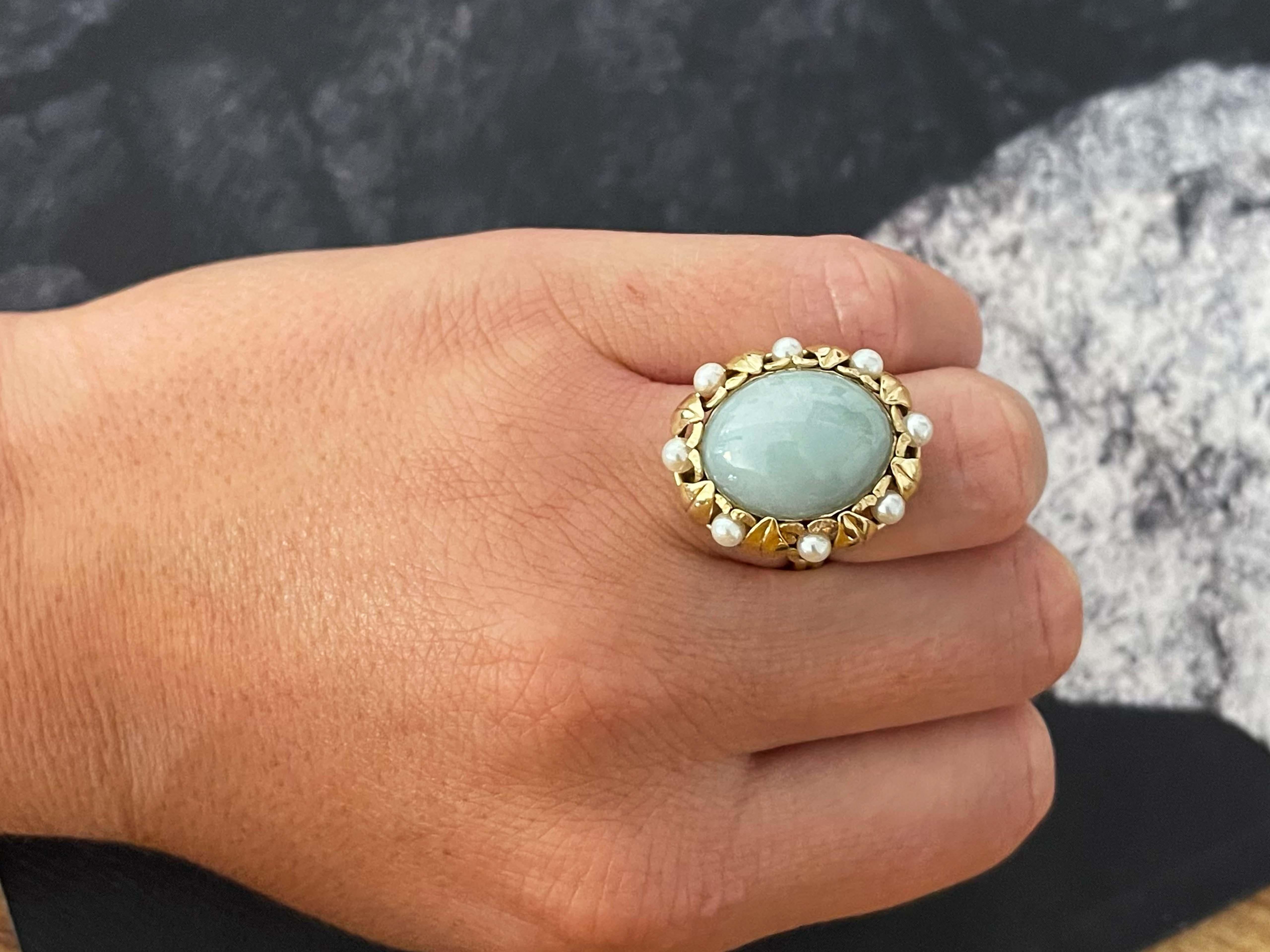 Ring Specifications:

Designer: Ming's

Stone: Pearl and Jade

Metal: 14k Yellow Gold

Total Weight: 10.7 Grams

Ring Size: 6.25 (resizable)

Stamped: 