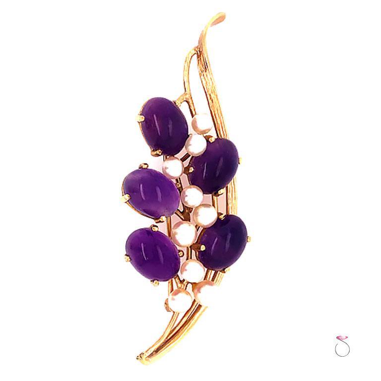 Beautiful Ming's Purple Amethyst & white Akoya Pearl flower brooch. The brooch features a floral design of five oval cabochon shape purple Amethyst and 9 small round white Akoya pearls. Each Amethyst piece is set securely in four prongs and