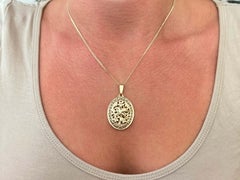 Ming's Hawaii Bird on a Plum Oval Pierced Necklace 14k Yellow Gold