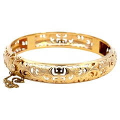 Brazalete con bisagra de oro de 14 quilates perforado Ming's Hawaii Longevidad 7" de oro amarillo