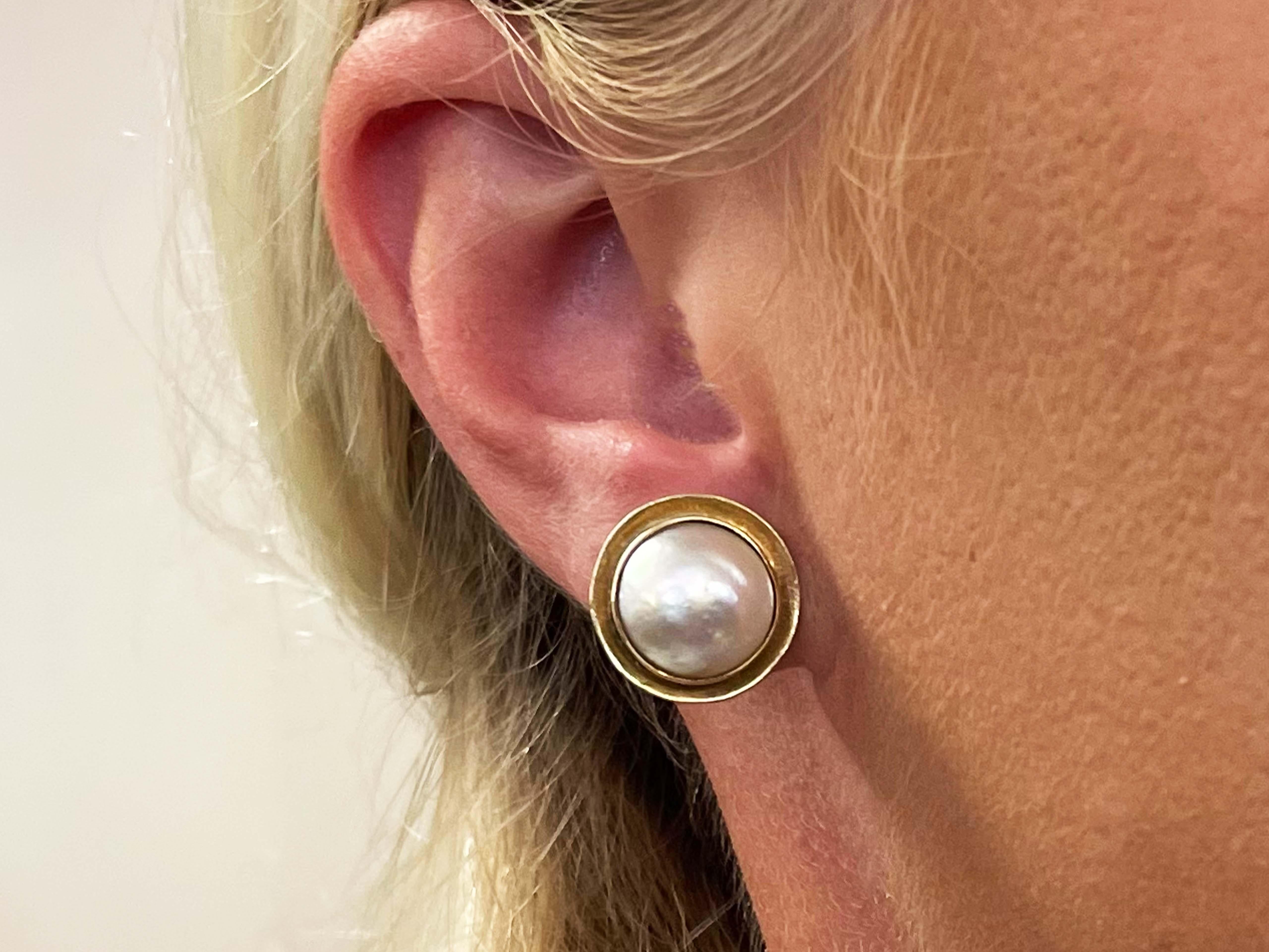 Earrings Specifications:

Designer: Ming's Hawaii

Metal: 14k Yellow Gold

Total Weight: 6.6 Grams

Pearl: Mabe

Pearl Diameter: 12.20 mm

Earring Diameter: 15.90 mm

Stamped: 