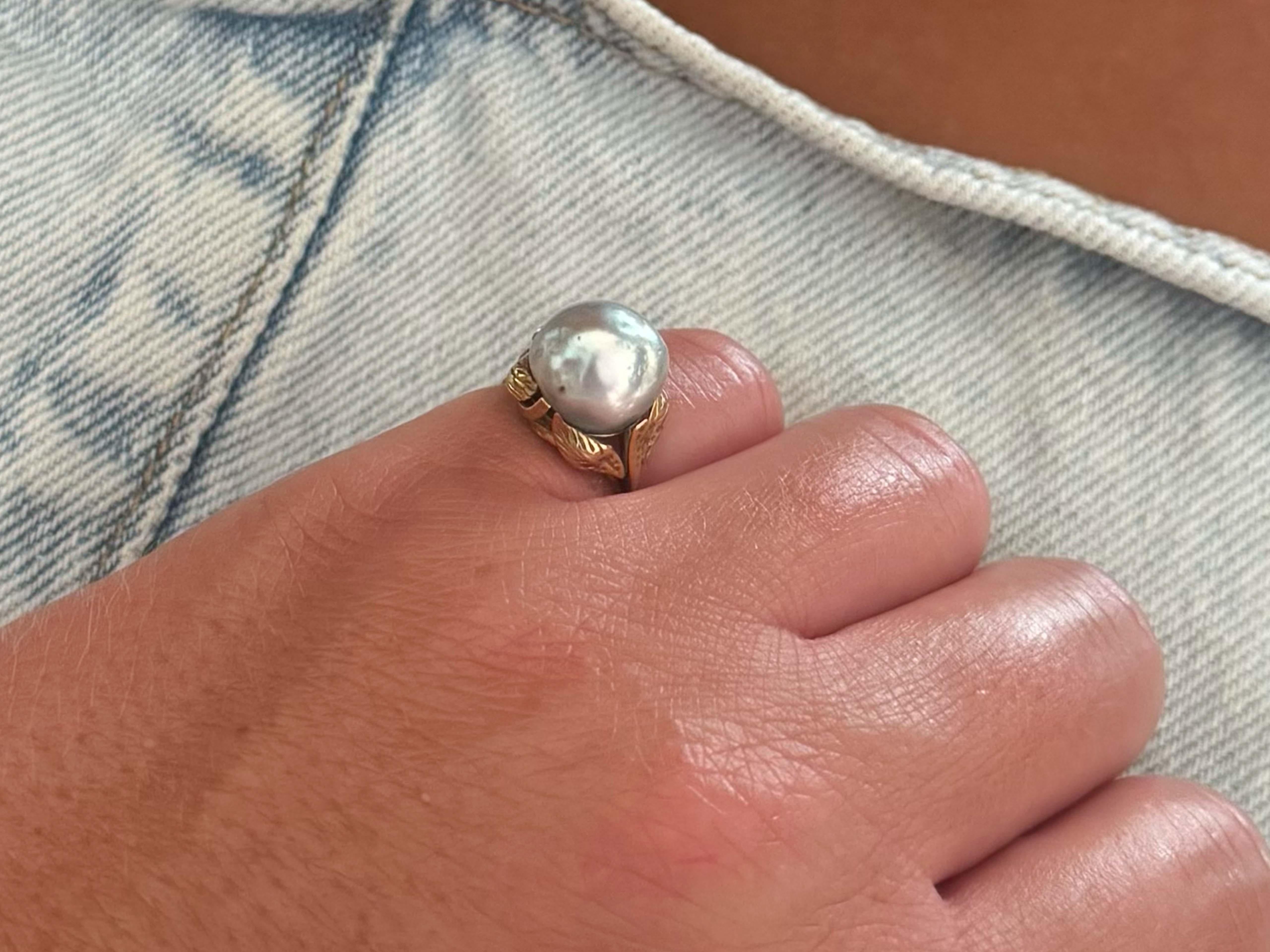 Specifications:

Designer: Ming's Hawaii

Metal: 14k Yellow Gold
​
​Pearl Diameter: 10.7 mm x 11.3 mm

Total Weight: 3.5 Grams

Ring Size: 4.75 (resizable)

Stamped: 