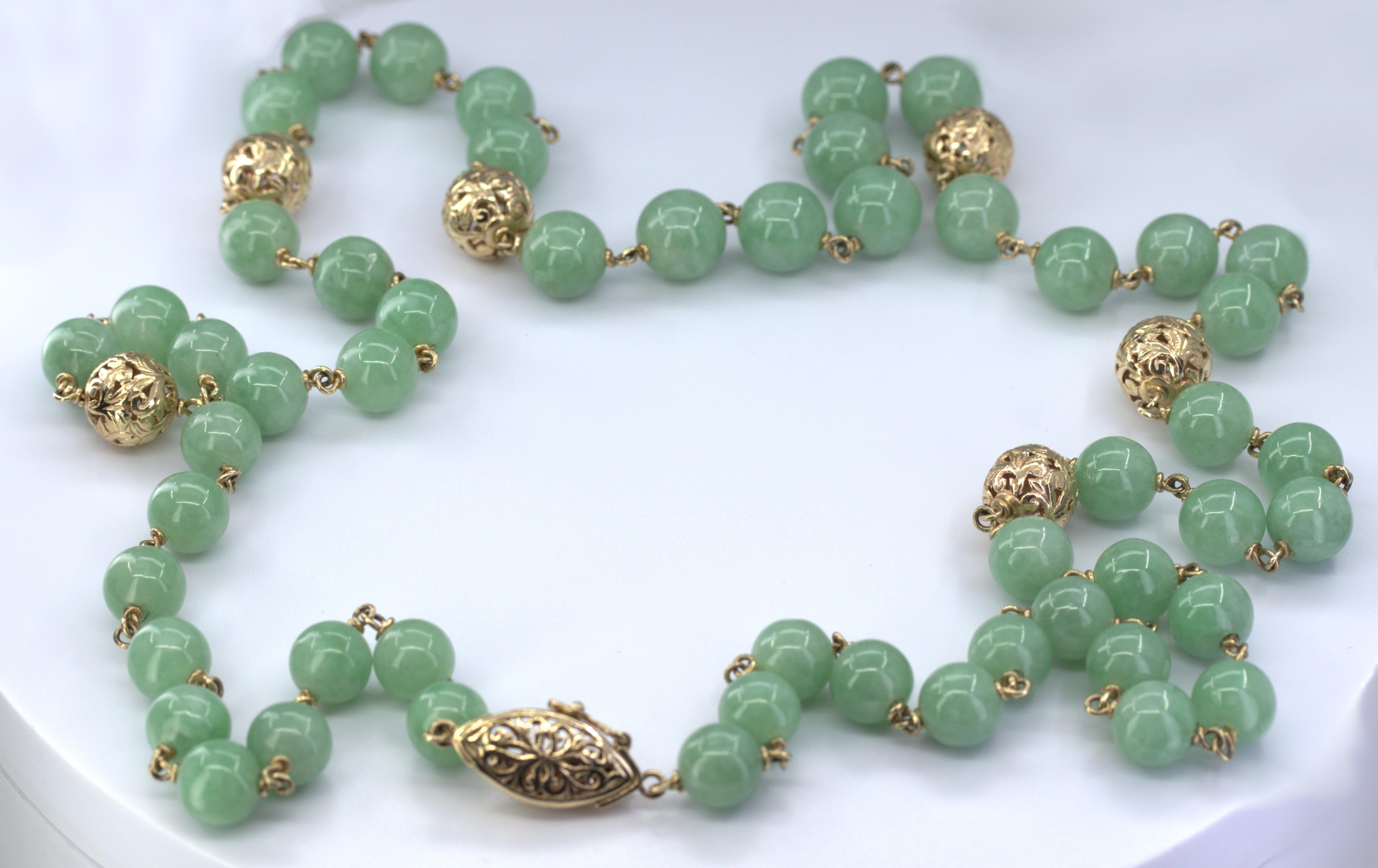 Composed of (53) natural untreated semi-translucent, semi-textured, 9.0 mm, green jadeite jade beads, accompanied by a Mason Kay Authenticity Report #230623-7660, dated June 23, 2023, stating Natural Jadeite Jade - no dye or impregnation detected –