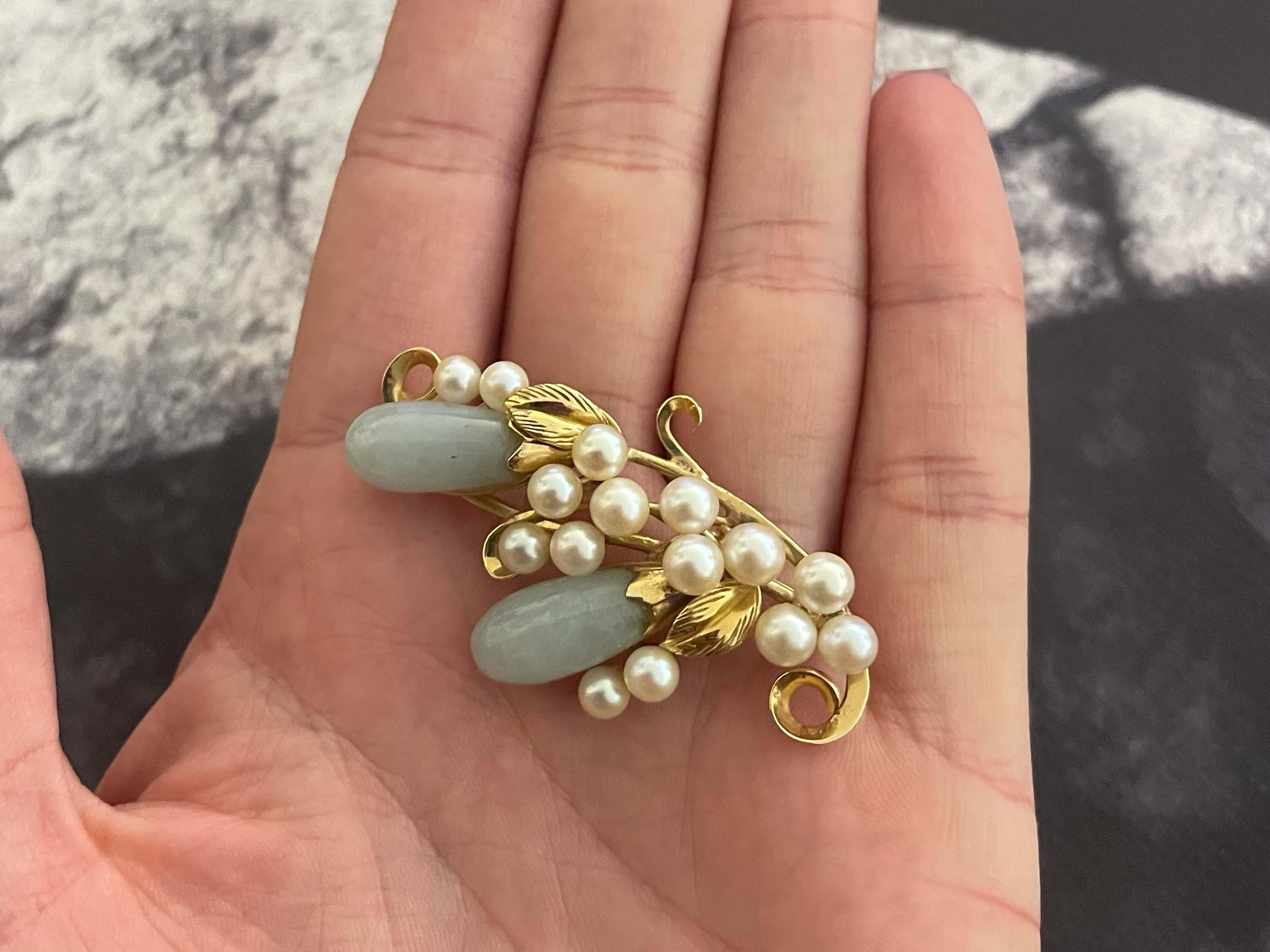 Brooch Specifications:

Designer: Ming's

Metal: 14k Yellow Gold

Total Weight: 12 Grams

Stones: Jade and akoya pearls

Brooch Measurements: 2