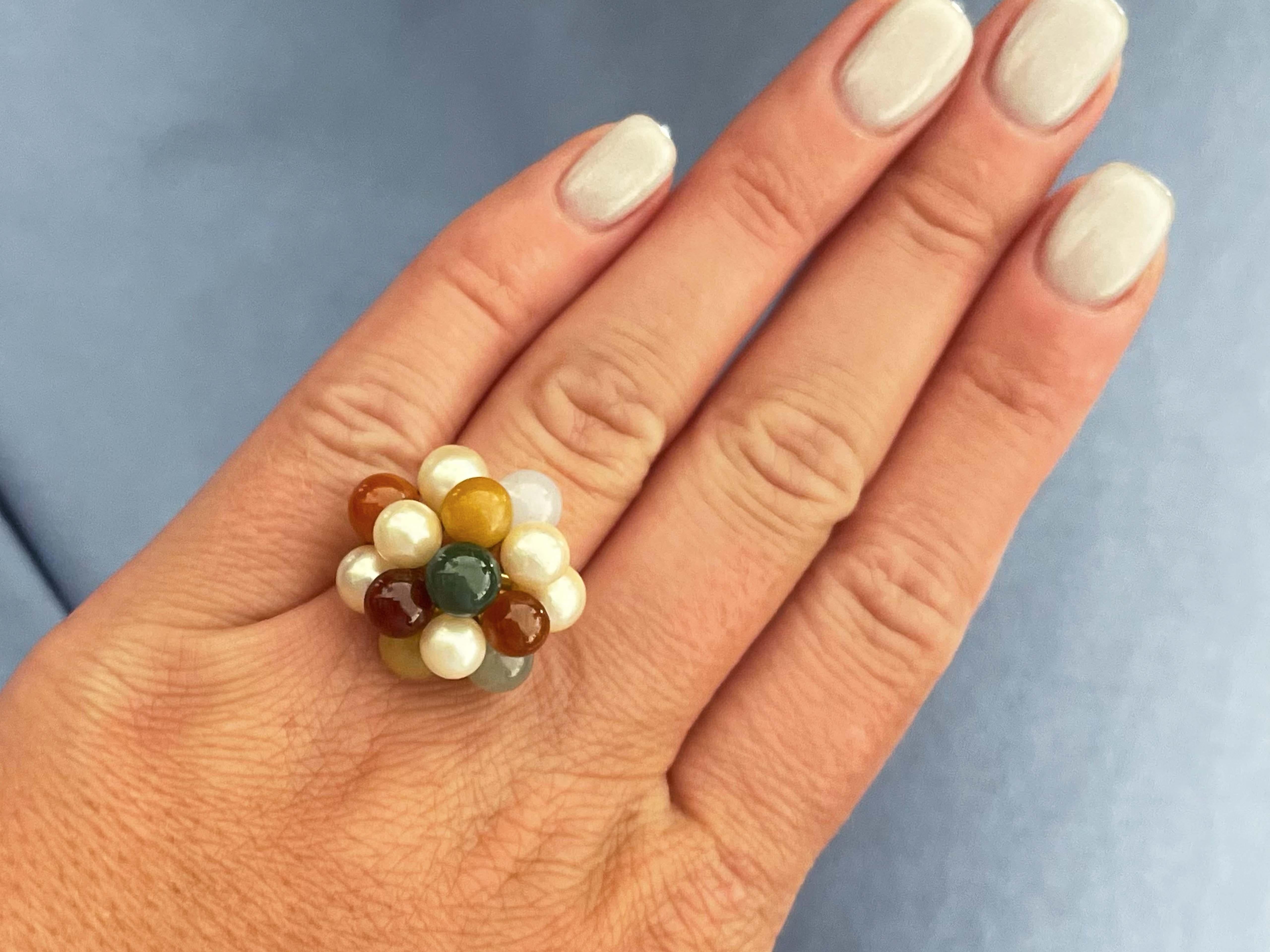 Spezifikationen:

Designer: Ming's

Metall: 14k Gelbgold

Perlen: Akoya

Jade: grün, braun, rot, bordeauxrot, orange

Gesamtgewicht: 9,4 Gramm

Ringgröße: 8 (größenverstellbar)

Gestempelt: 