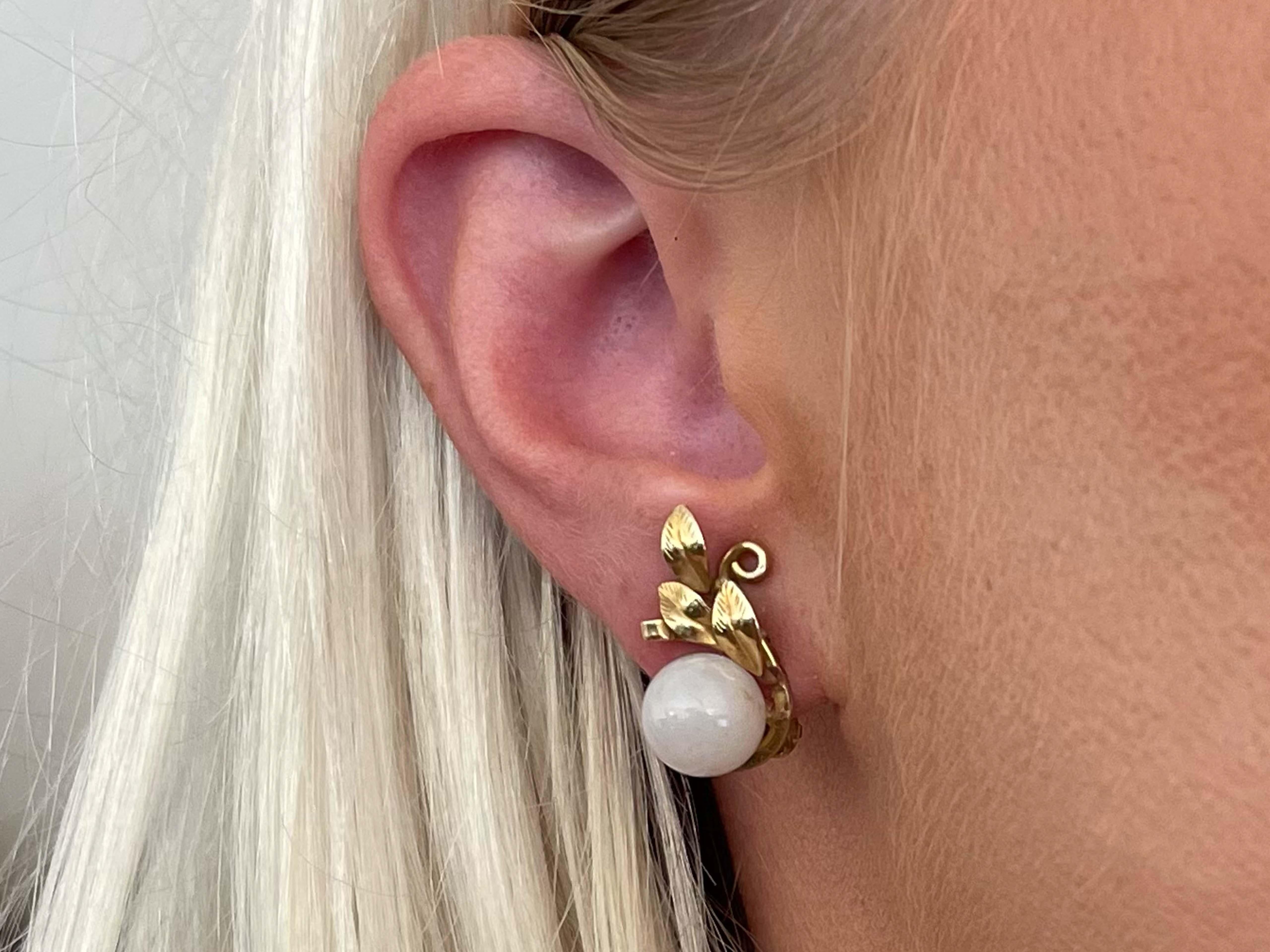 Earrings Specifications:

Designer: Ming's

Metal: 14K Yellow Gold

Total Weight: 7.4 Grams

Jade: White Jade

Stamped: 