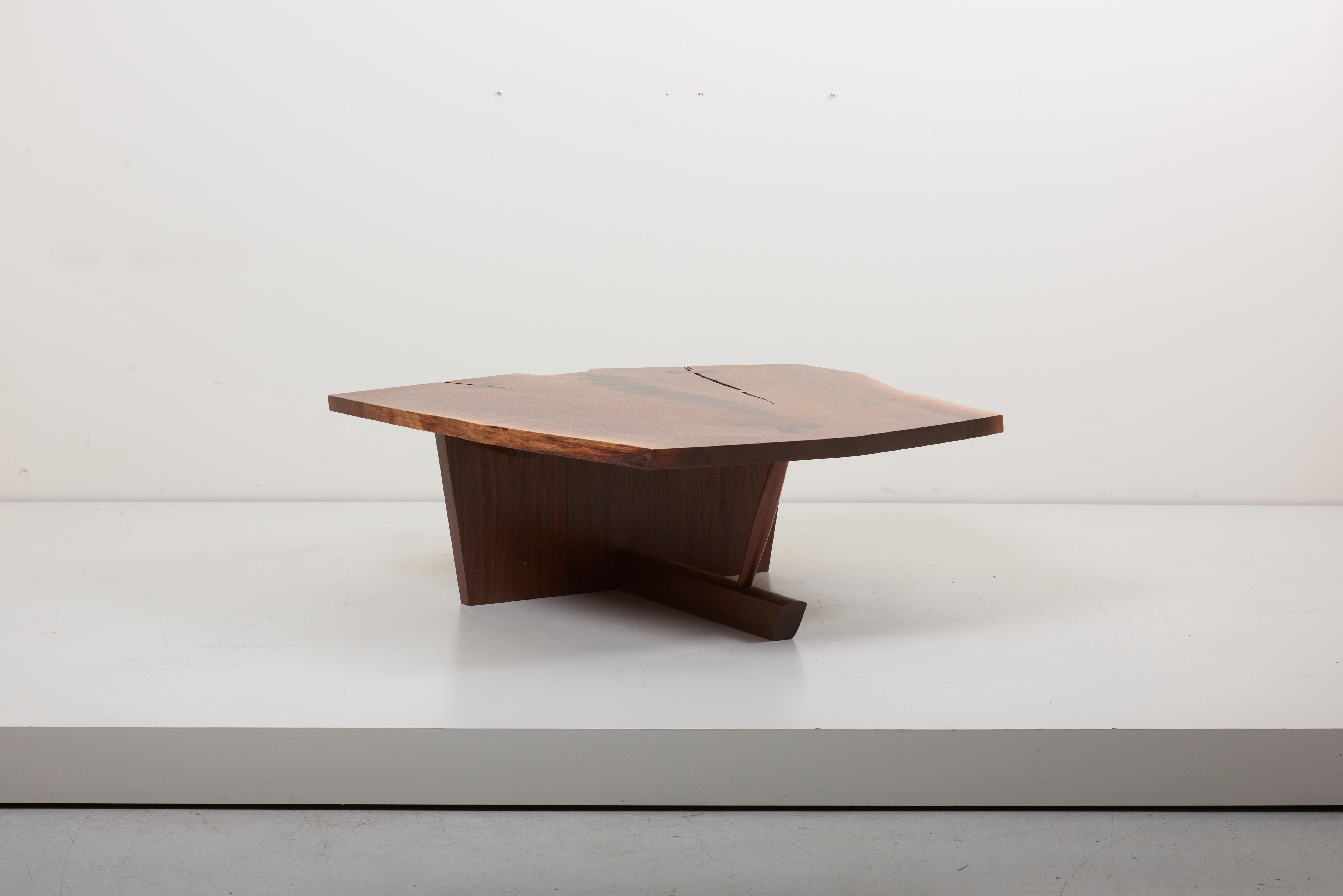 Excellent Nakashima walnut coffee table atop a rare Ming II base. Nice expressive top with sap edge and a crotch cut edge. Complete provenance included. Including copies of original drawings.