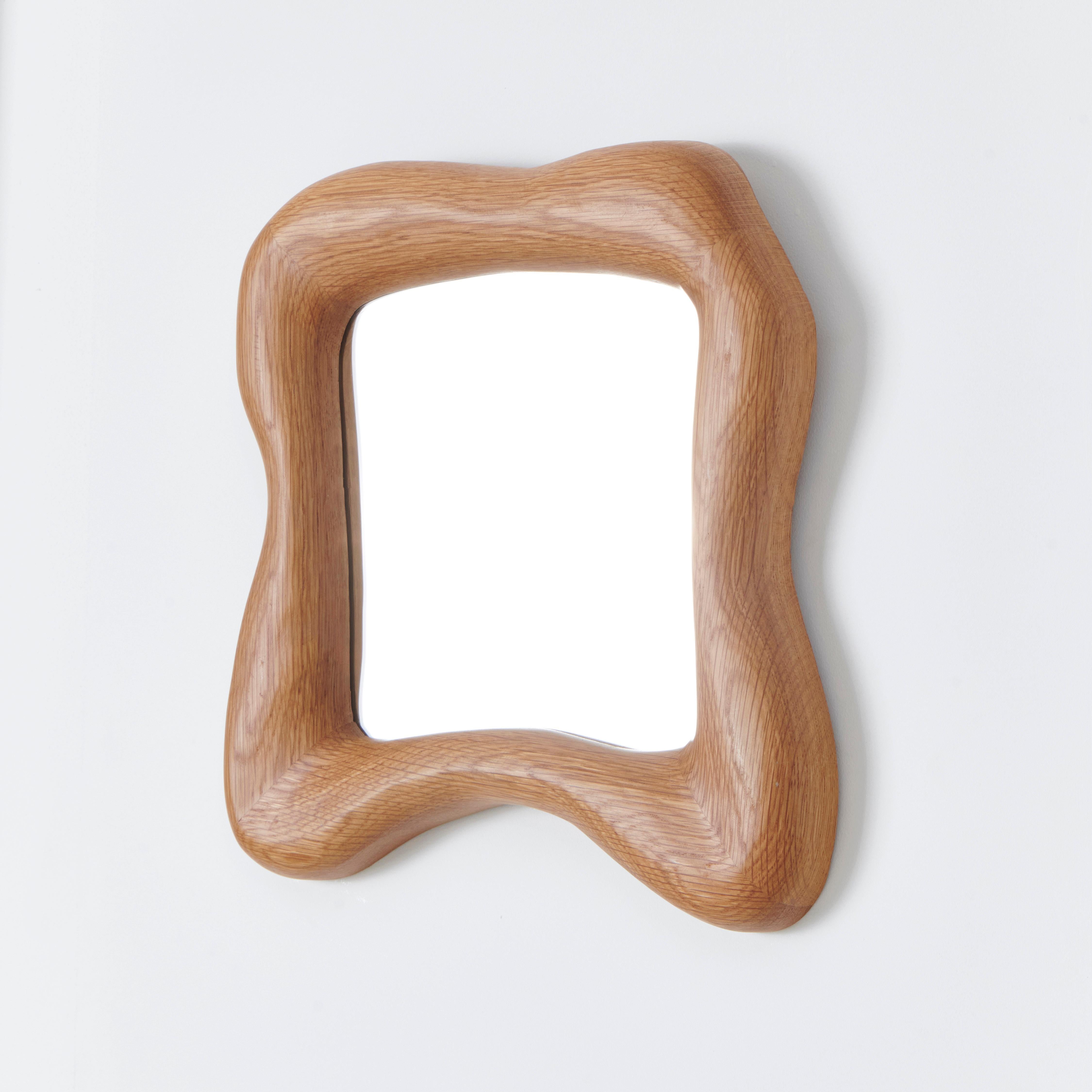 Minho Mirror
Designed by Project 213A in 2024

The Minho mirror is framed in solid wood with an abstract organic shape.
Crafted by Skilled artisans in Northern Portugal.
Bespoke dimensions available upon request

Please note wood is a natural