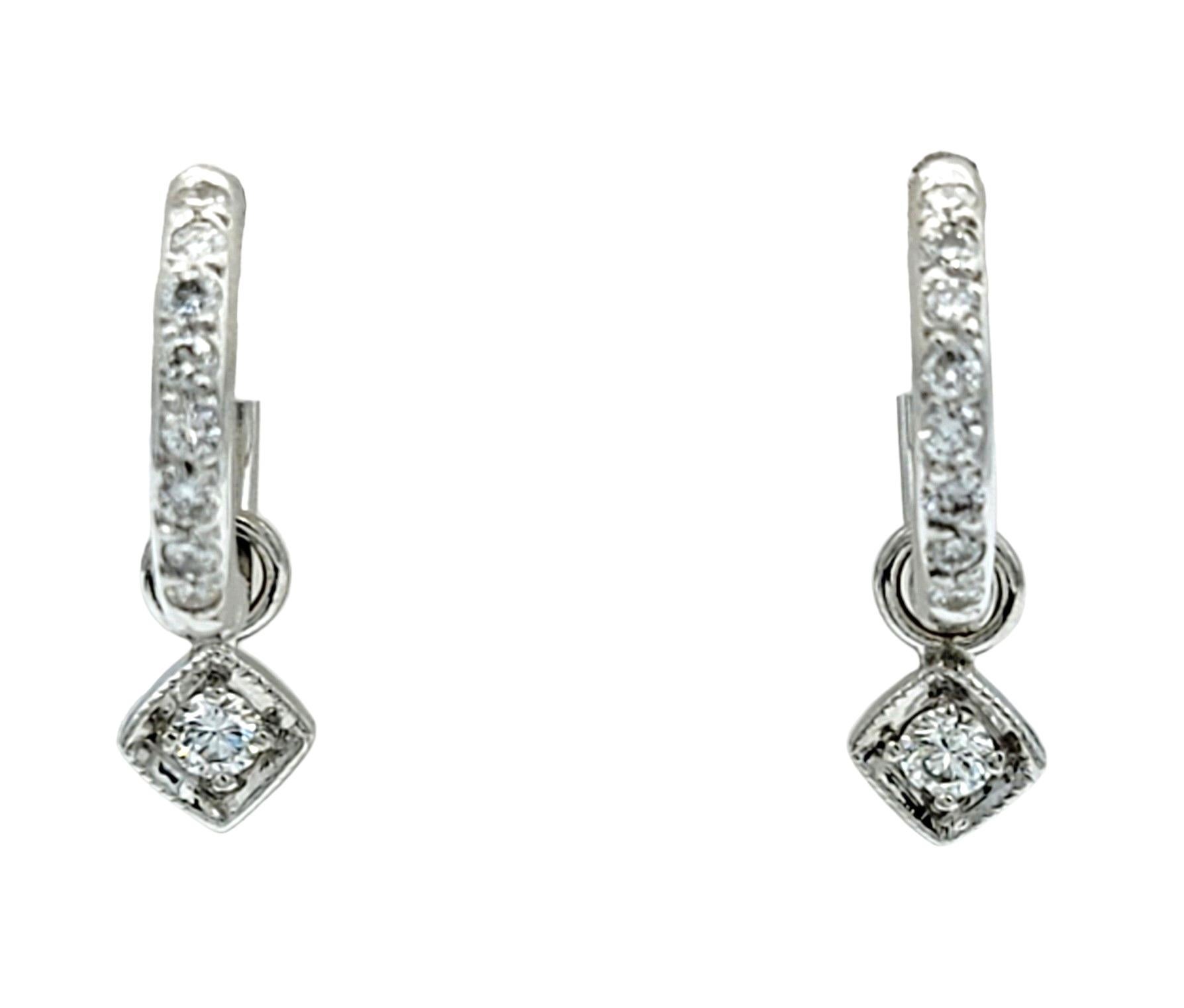 Enhance your everyday elegance with these exquisite mini diamond hoop earrings, crafted in shimmering 14k white gold. Each hoop features a delicate row of brilliant round-cut diamonds, adding a touch of sparkle to any ensemble.

The highlight of