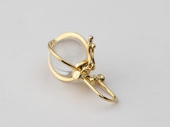 Mini collier amulette en or 18k avec orbe en cristal de roche