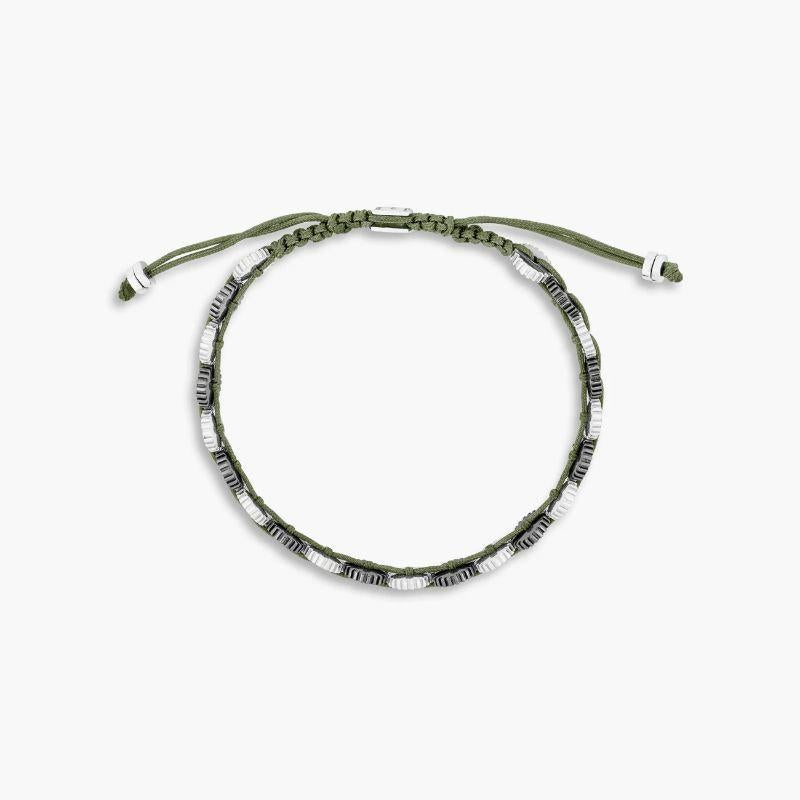 Mini 21 Gear Bracelet with Khaki Macrame in Rhodium and Black Rhodium Plated Silver, Size L

Twenty one, two-tone mini gears sit together, secured by a line of hand knotted khaki-coloured macrame. Our most iconic elements are brought together in a