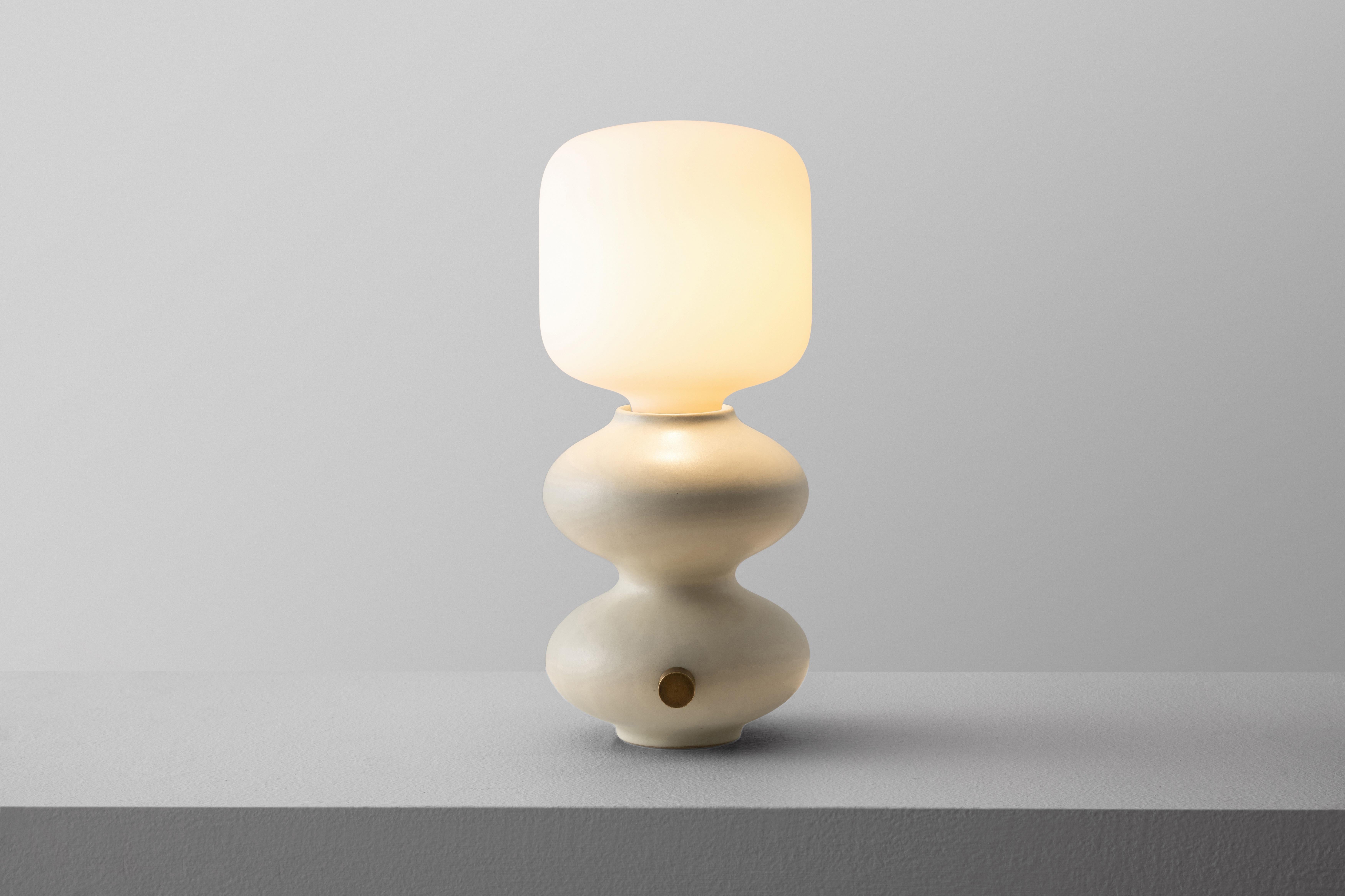 Mini Alabaster Wave Form Table Lamp by Forma Rosa Studio
Dimensions: D 14 x W 14 x H 30.5 cm.
Materials: Ceramic, brass.

Available in Oxblood, Green, and Alabaster colors.

Our Wave Form Table Lamp Mini in Green is our classic timeless design,