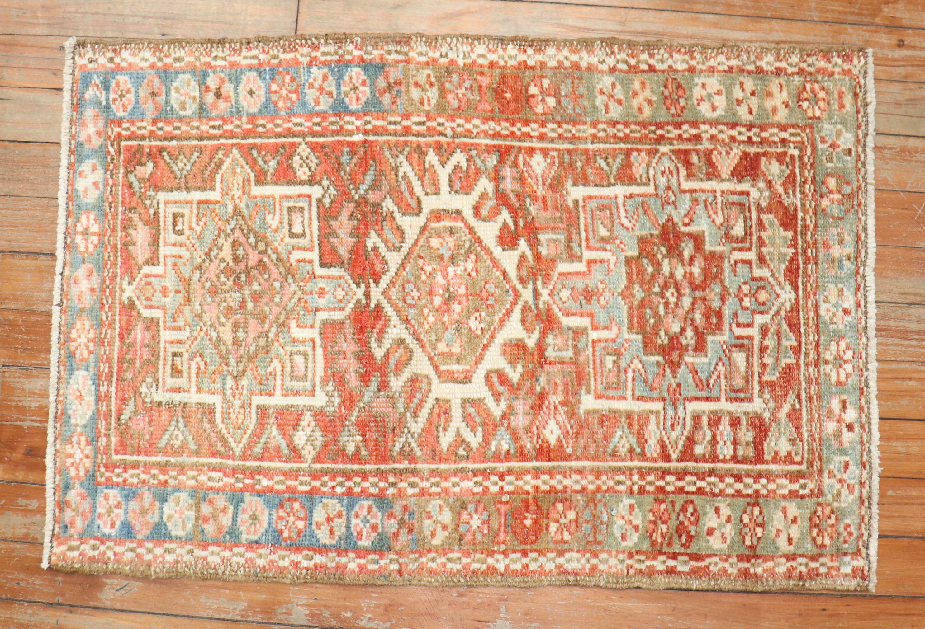 An early 20th century colorful Persian Heriz small rug with your traditional medallion and border motif 

Measures: 1'11'' x 2'8''.
