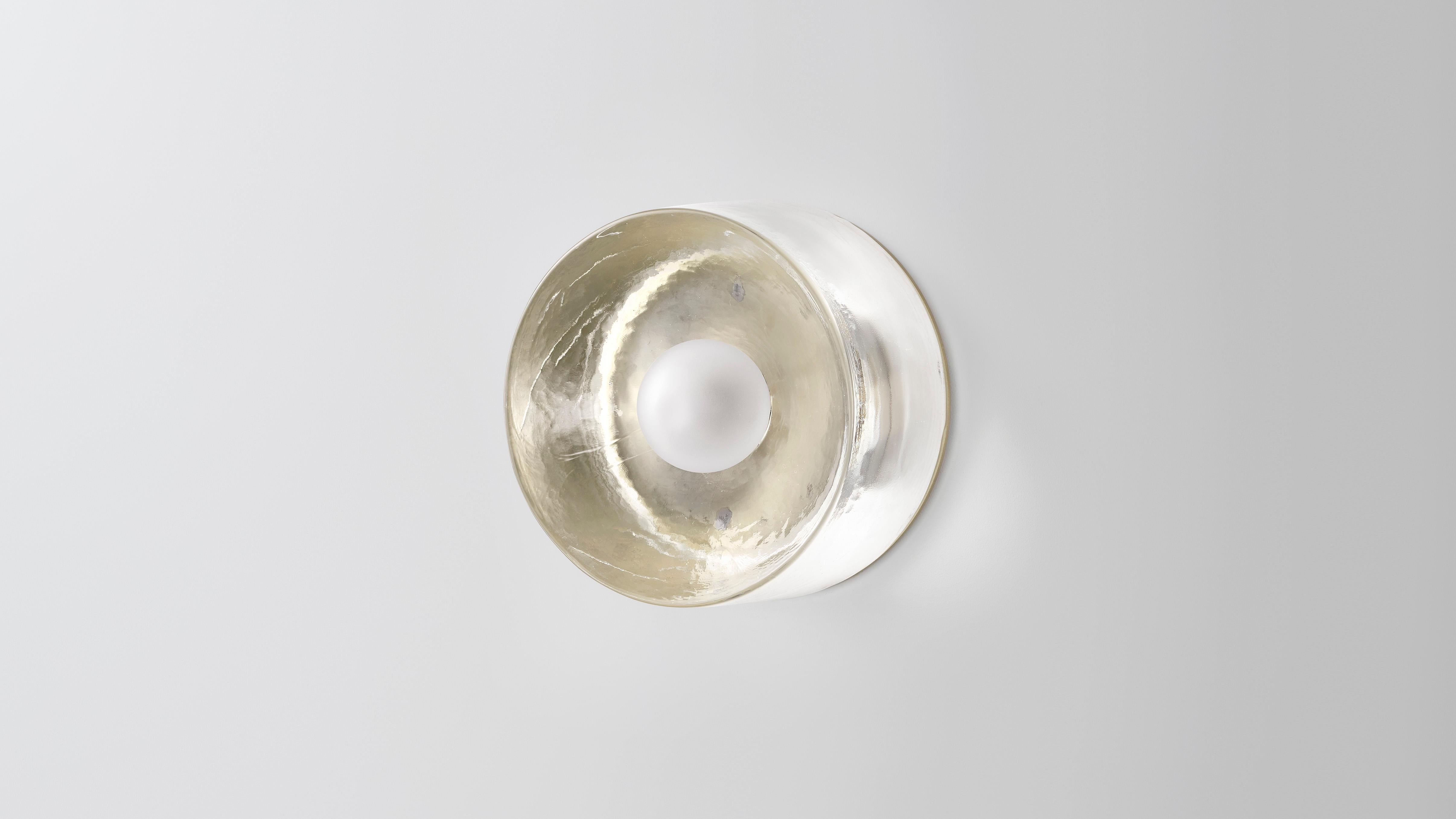 Mini anton glass wall scounce by Volker Haug
Dimensions: Diameter 13 cm x depth 8.3 cm 
Material: Cast glass
Backing Plate: Polished, bronzed or chromed brass
Lamp: G9 LED (240V / 120V US). 12V option available.
Glass Bulb: 45mm ø, Frosted
Weight: