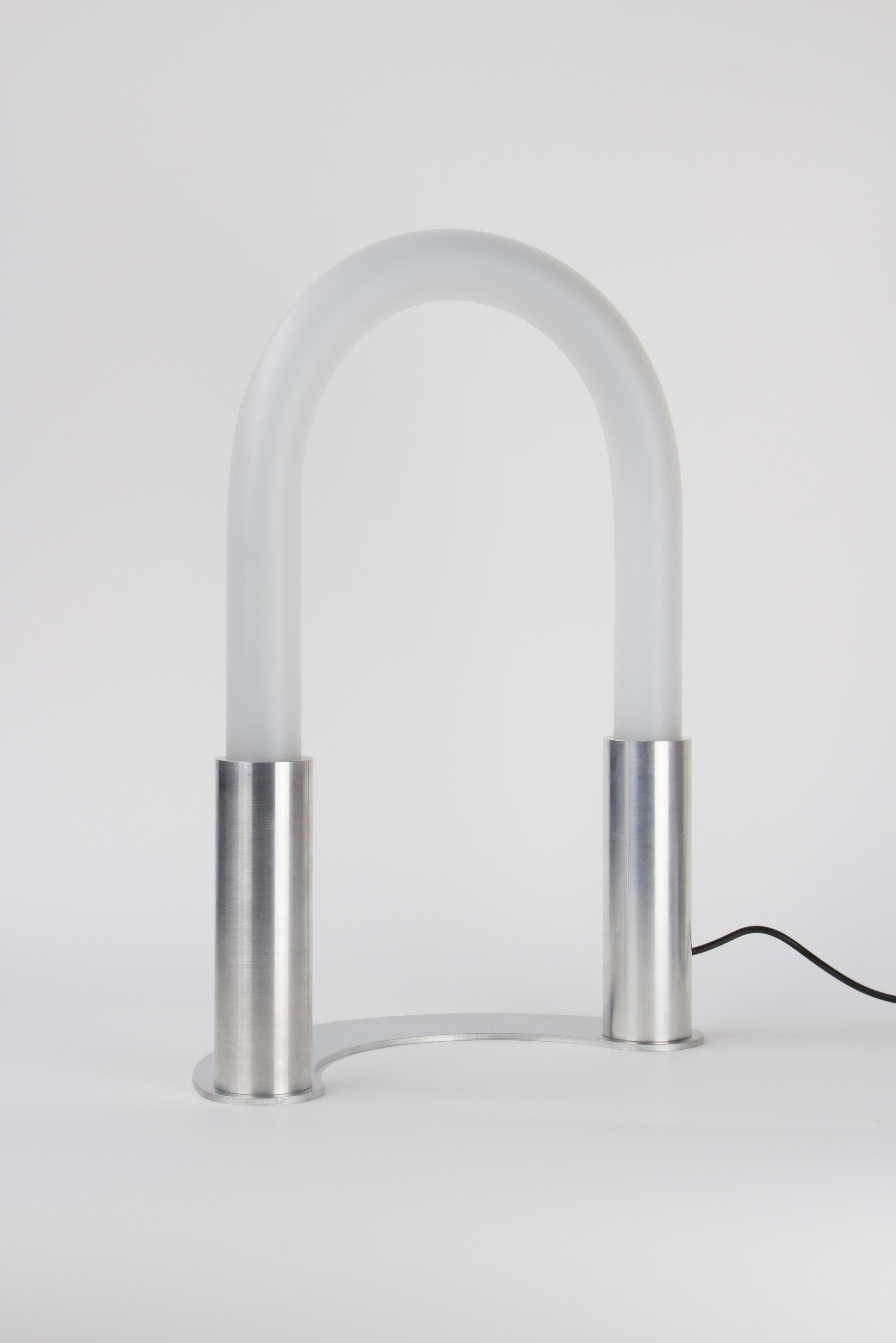 Mini Arceo table lamp by Joachim-Morineau Studio
Dimensions: W 15 x D 25 x H 35 cm.
Materials: Aluminium tubes and sheets, LED 360 light, satin acrylic tubes.

Mini Arceo is a reproduction of our ARCEO installations as a table lamp.

Mini