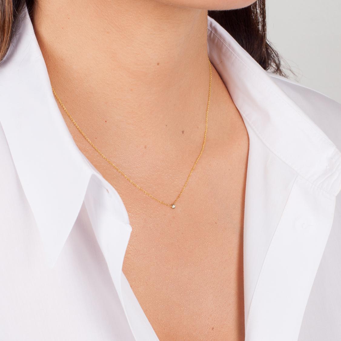 Beautifully handcrafted round single diamond in a 14k solid gold mini bezel cup hanging from a dainty cable link chain. Chic and timeless, wear it by itself or layered, day or night.

Made in L.A.
14k Yellow Gold
16