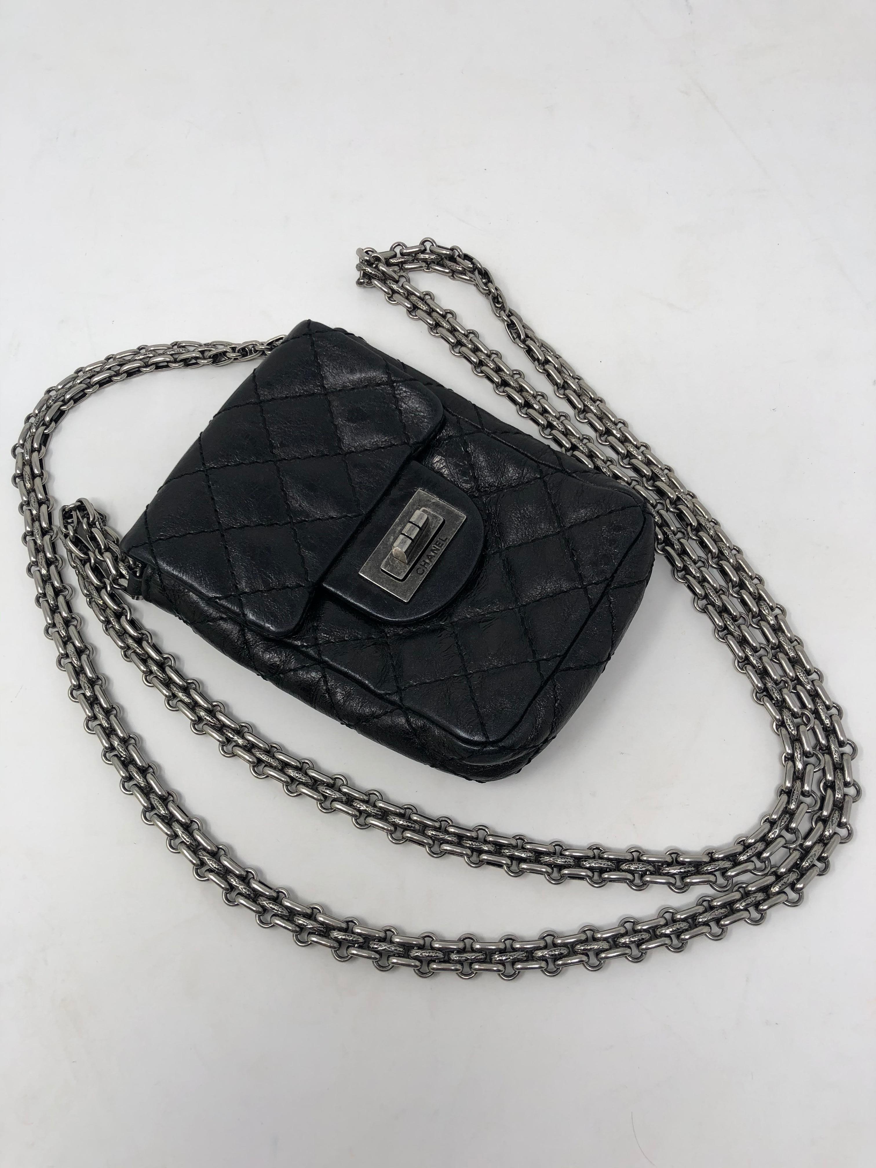 Mini Black Chanel Camera Crossbody Bag. Distressed black leather with antique silver hardware chain. Crossbody bag that will fit a small camera. Excellent condition. Rare style. Guaranteed authentic. 