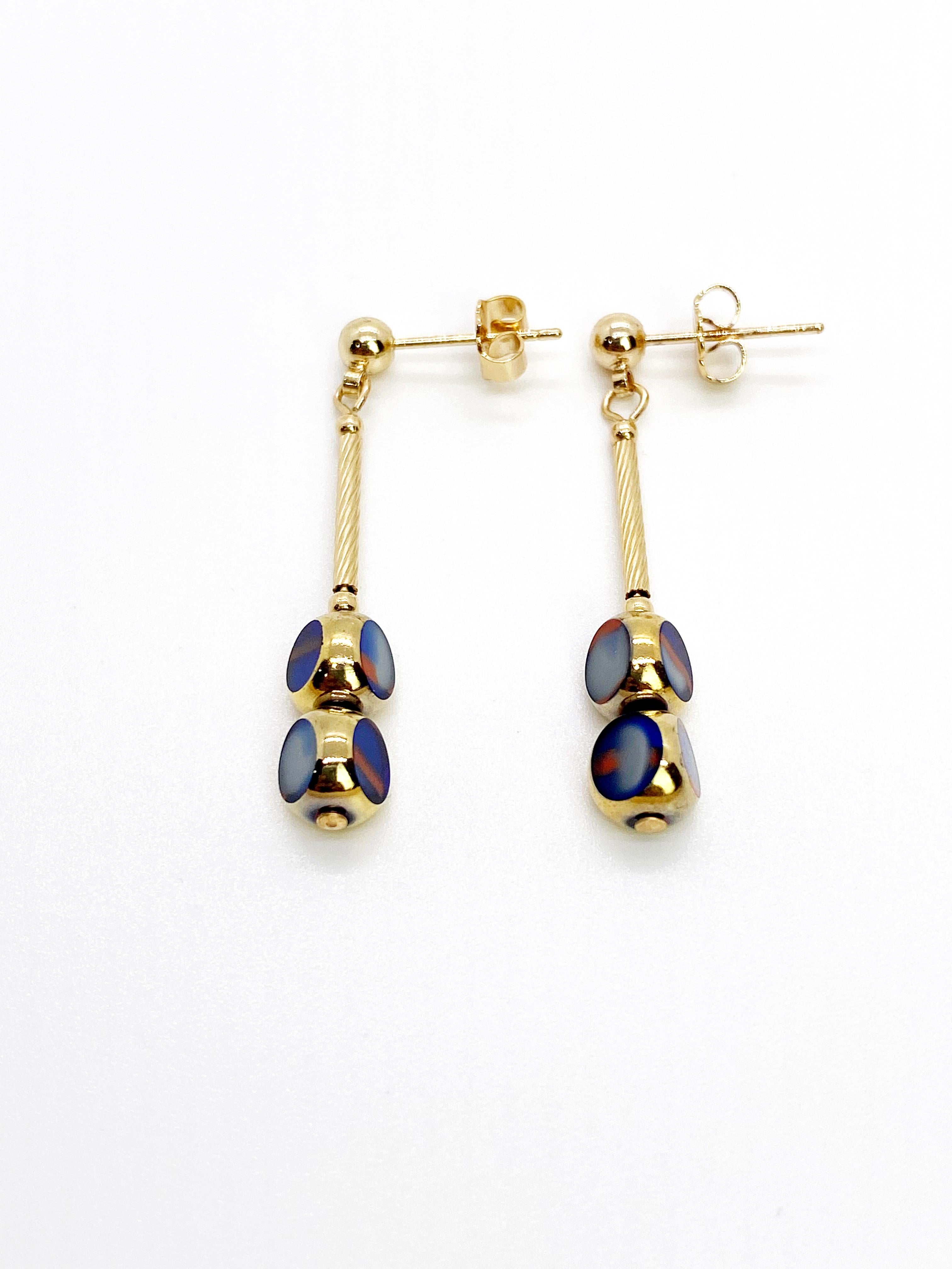 Mini blue marbled vintage German glass beads edged with 24K gold dangles on 14K gold filled metals and ear stud.

The German vintage glass beads are considered rare and collectible, circa 1920s-1960s.

*Our jewelry have maximum protection for