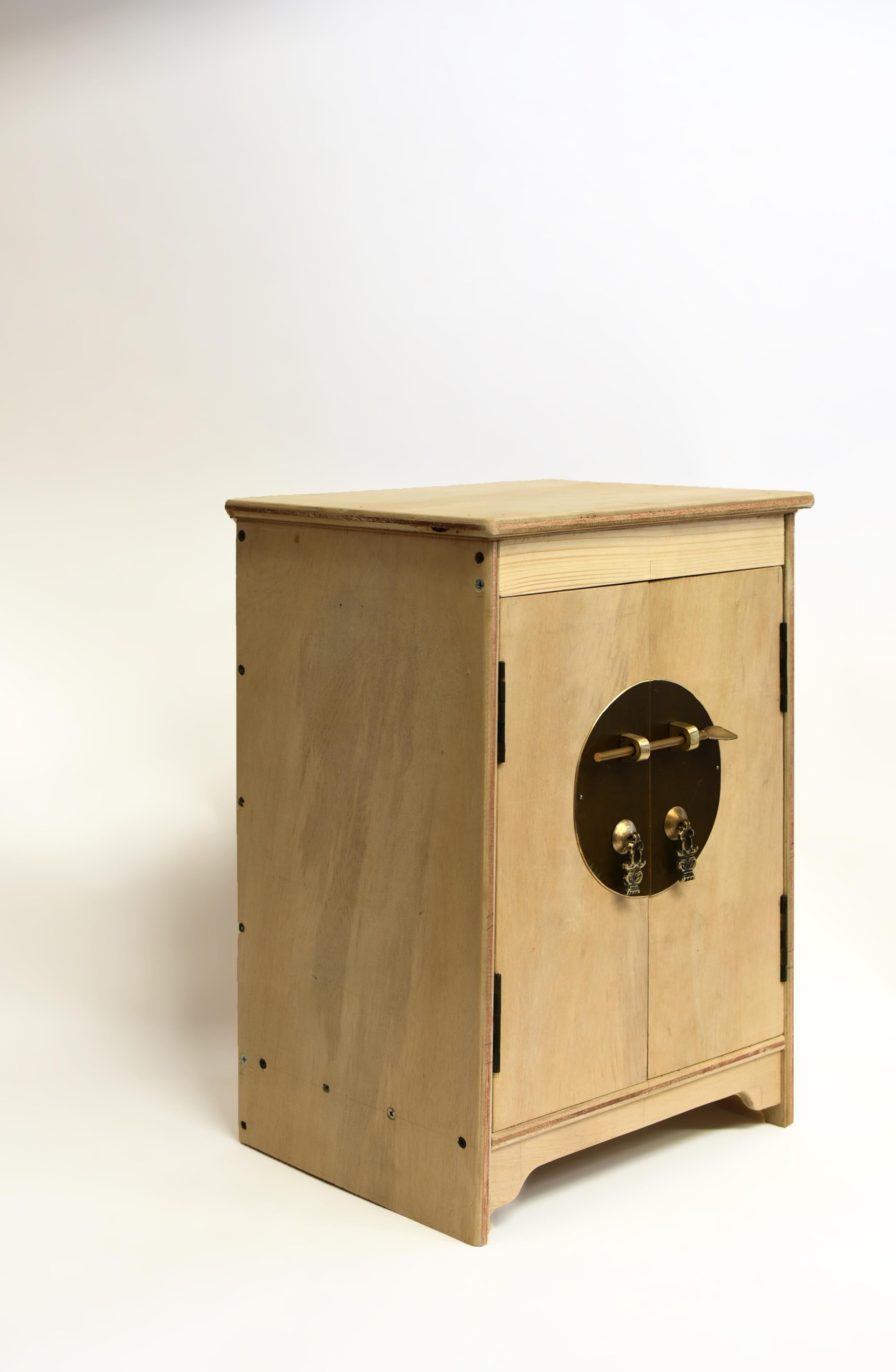 A beautiful, light weight, small cabinet by the Chinese furniture master Zhong. The design based on Ming dynasty round corner cabinets, with doors set between horizontal stretchers under a single panel top with rounded corners. An elegant apron sits