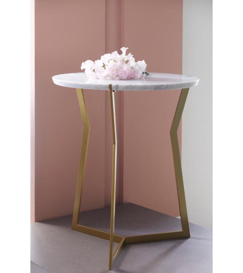 Mini Carrara Marble Star side table by Olivier Gagnère
Materials: Pedestal table, 20mm Carrara or Marquina marble top. Base in gold lacquered metal.
Technique: Lacquered metal, polished marble. 
Dimensions: Diameter 40 x H 40 cm
Also available