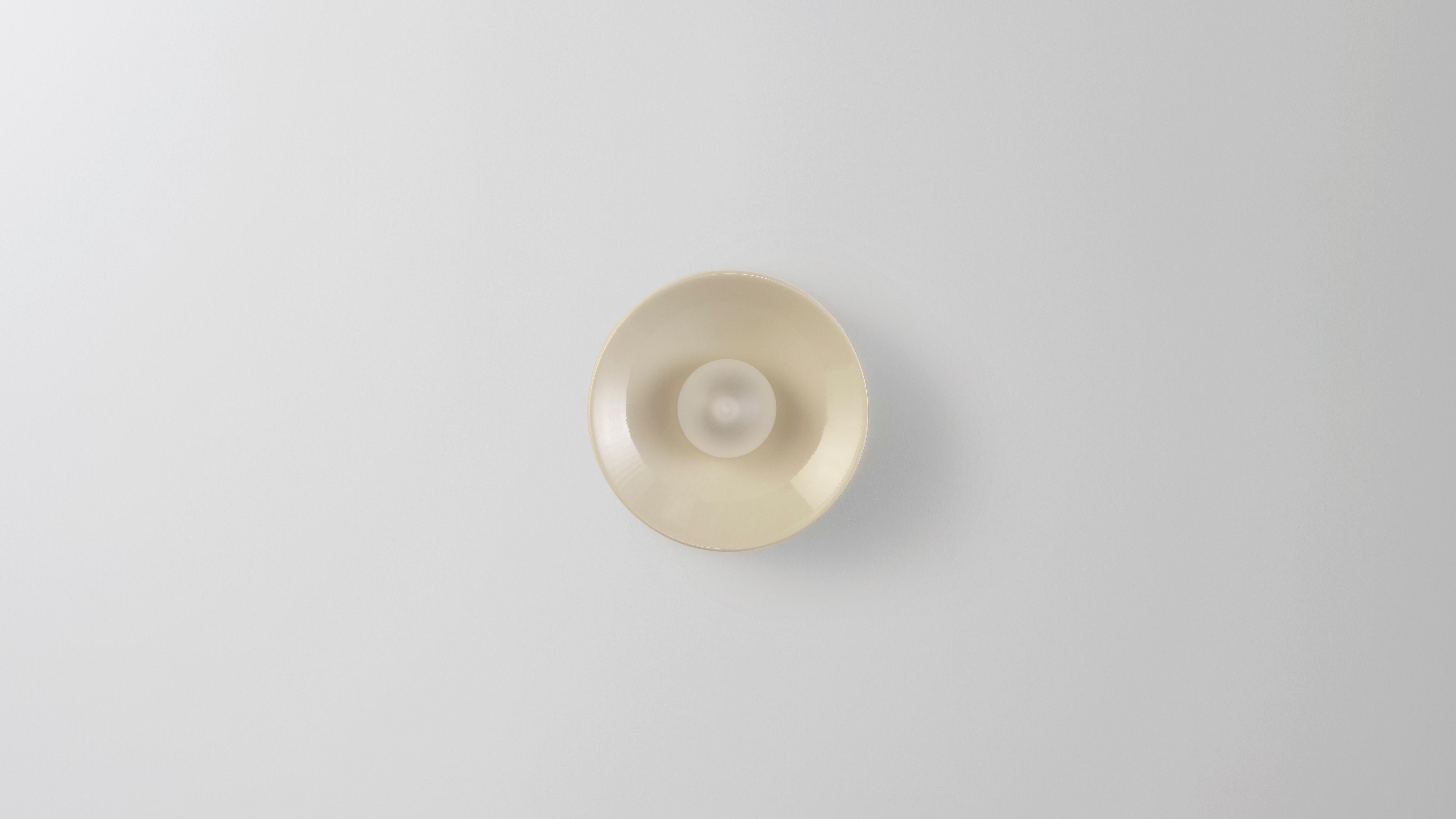 Mini ceramic Anton wall scounce by Volker Haug.
Dimensions: Ø 13 x D 8 cm.
Material: Cast Ceramic
Glaze: a selection of colours are available
Lamp: G9 LED (240V / 120V US). 12V option is available.
Glass Bulb: 45mm ø, Frosted
Each cast piece is