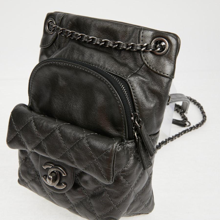 Chanel mini backpack in charcoal gray lambskin.  Rare and trendy model.
It is lined in leather and black canvas. The hardware is in ruthenium metal. There is a zip pocket. 
Easy to wear even on the shoulder.
It has never been worn. 
Made in Italy.