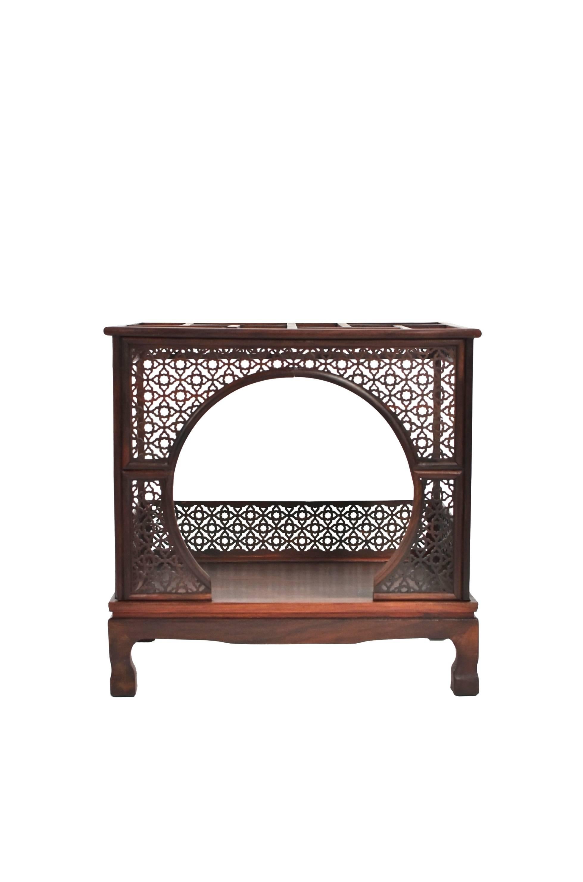 Beautiful miniature, finely carved model is the exact replica of a Chinese traditional moon bed. The bed is decorated on all sides by carved panels in an intricate pierced pattern. The moon entrance is dramatic and very romantic. The top of the bed