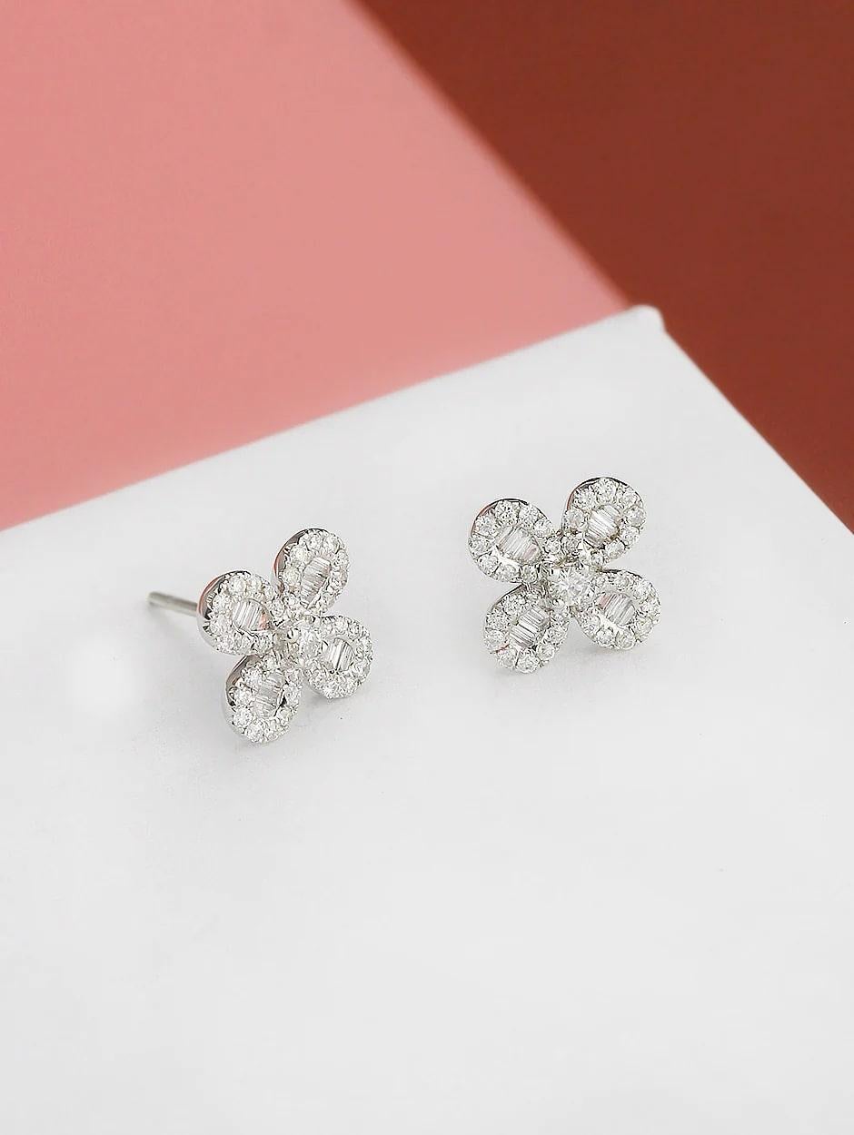 Combination of micro pave and baguette diamond clover earring, all with a high polish finish. Available in 18K White Gold.

Earring Information
Diamond Type : Natural Diamond
Metal : 18K
Metal Color : White Gold
Diamond Carat Weight :