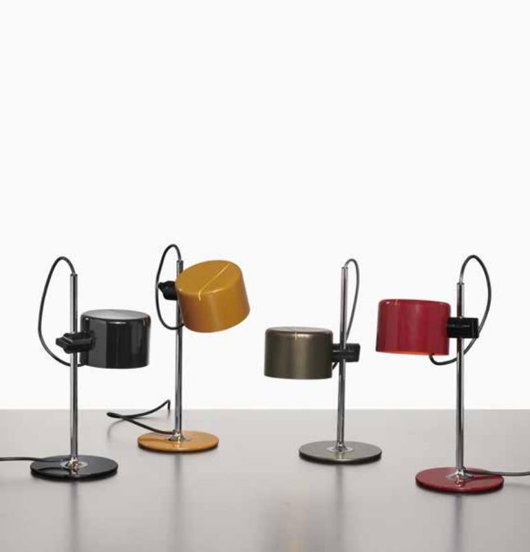 Mini coupe table lamp by Joe Colombo for Oluce. Current production manufactured in Italy. Chrome, enameled aluminum. Wired for U.S. standards. Light adjust to various heights. After declining it over time in different models and finishes, this year