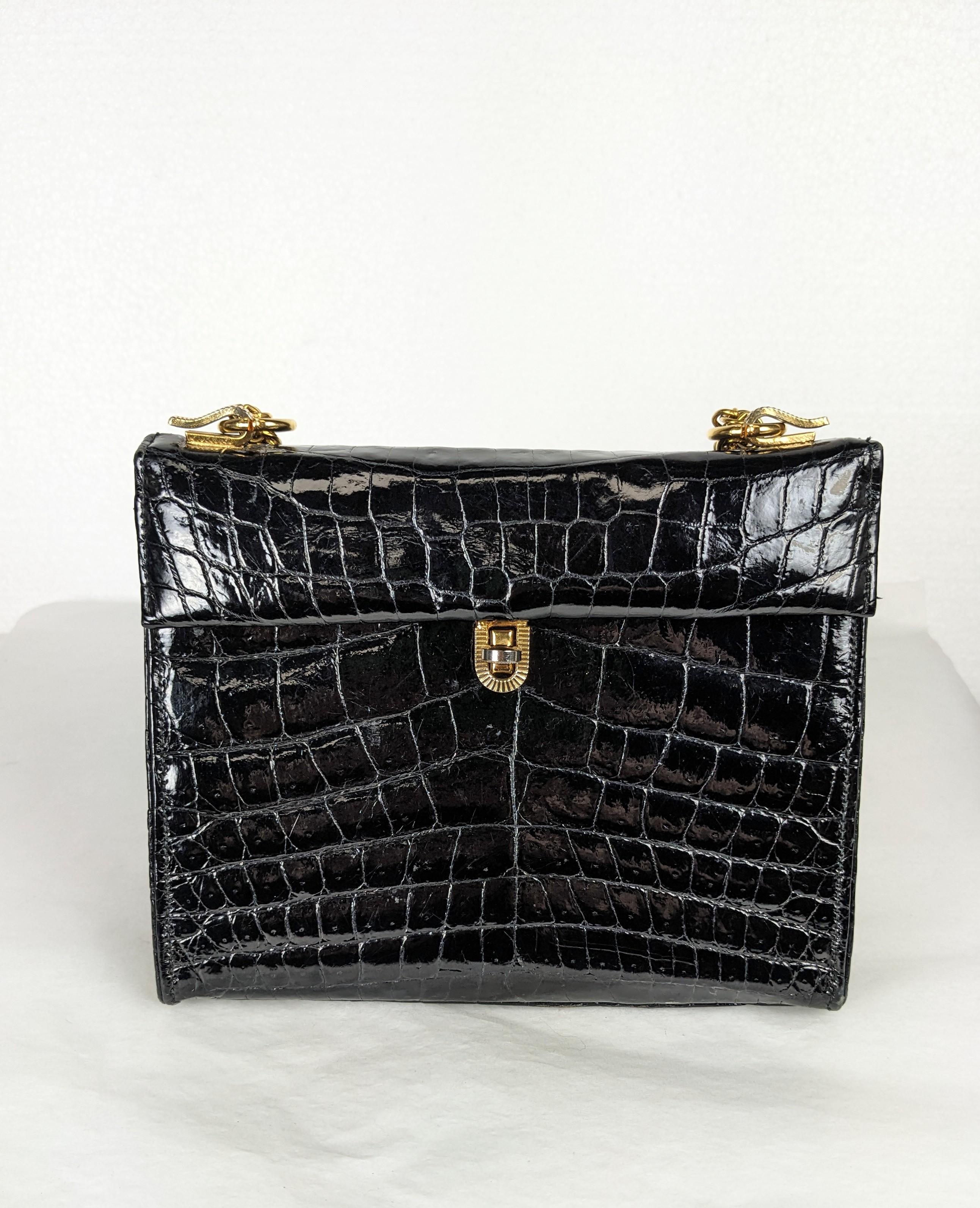 Charming Mini Alligator Structured Shoulder Bag with long gilt chain and center cut front skin. Great size which allows chain to be doubled. Faille lined,
6.75