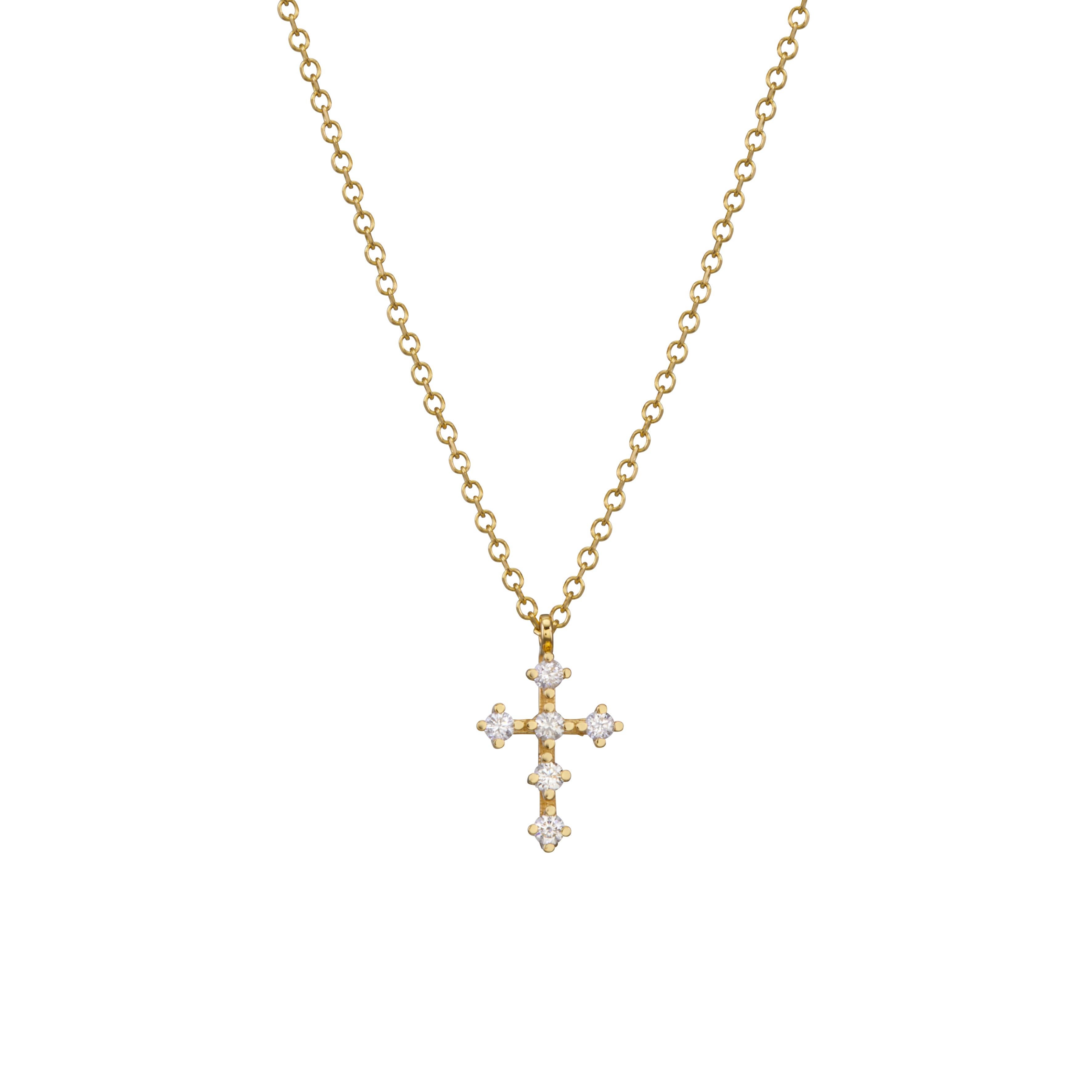 Original et élégant, le mini-pendentif en forme de croix s'accorde avec tous les looks. Conçu pour être confortable pour un usage quotidien.
Le collier Croix est façonné à la main, en or jaune 18 carats avec  diamants de taille brillante.
Un beau