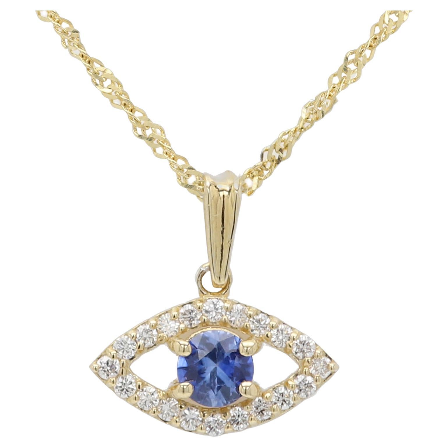 Mini œil maléfique en or jaune 14 carats avec saphir bleu naturel au centre