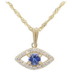 Mini œil maléfique en or jaune 14 carats avec saphir bleu naturel au centre