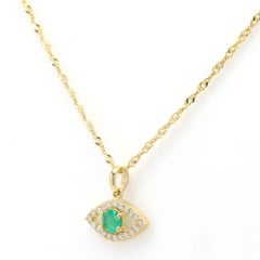 Mini diamante Evil Eye in oro giallo 14 carati con smeraldo verde naturale centrale