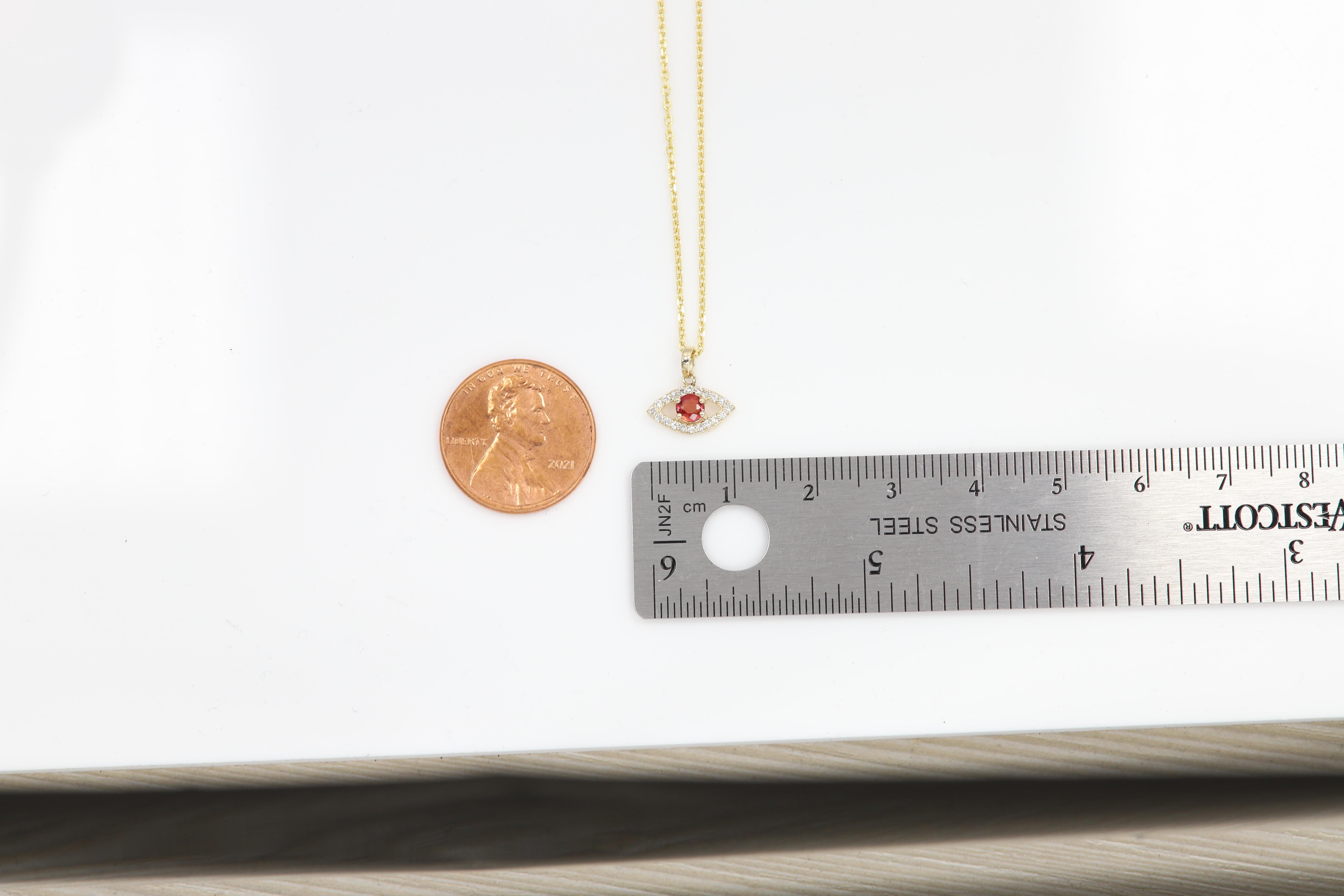 Unique Gold Mini Evil Eye Pendant

14k Yellow Gold  0.40 grams (without the chain)
Quality diamonds G-F-VS approx 0.12 carat.
the small size makes it very cute and trendy.
Center  Stone is a natural Red Sapphire of 3.5 mm approx 0.15 carat.

overall