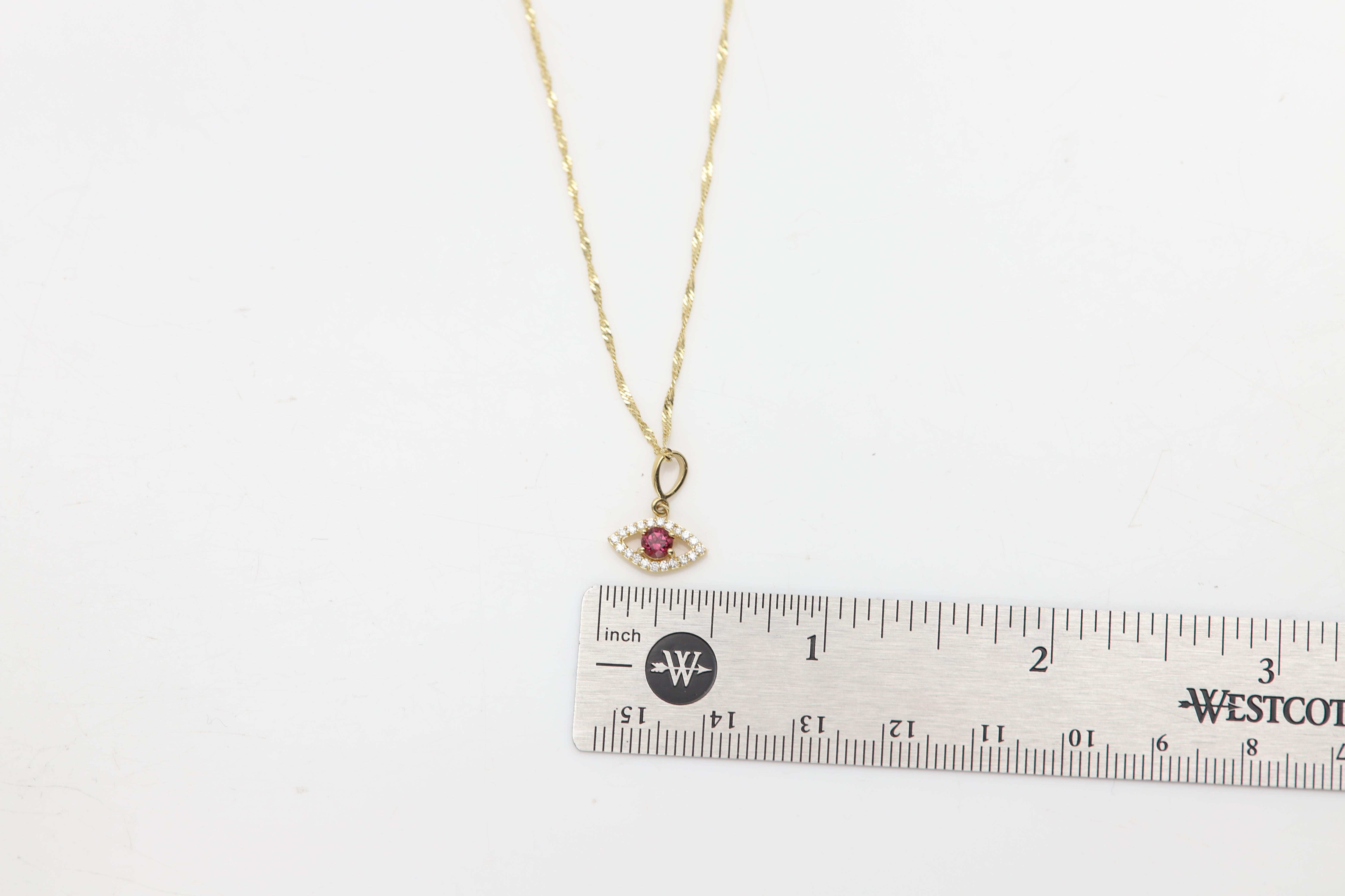 Mini Diamante Mal de Ojo Oro Amarillo 14 Kilates con Centro Rodolita Natural en venta 1