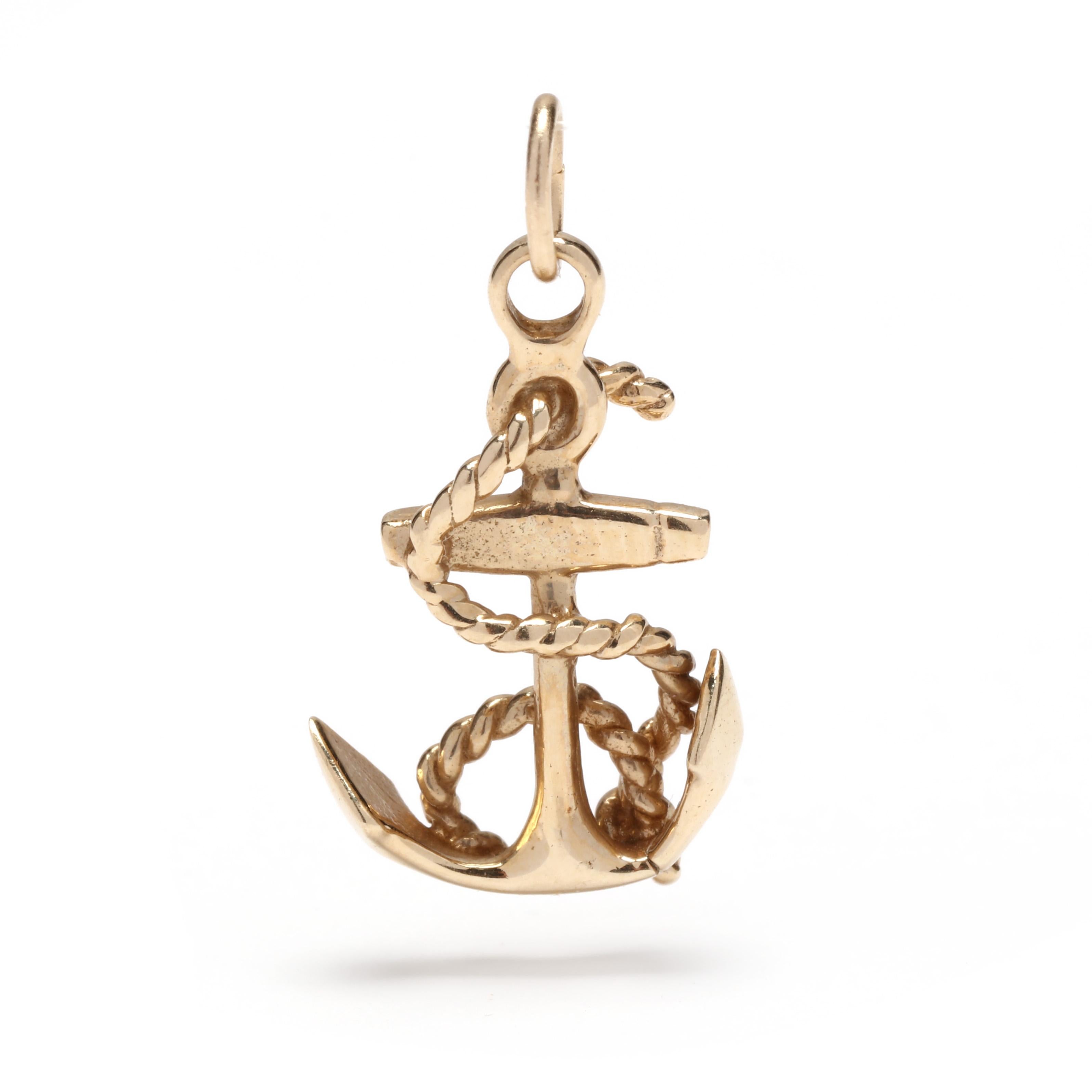 A vintage 14 karat yellow gold mini anchor charm. This saline charm features a small polished anchor motif with a coiled rope motif throughout and with a thin bail.

Length: 7/8 in.

Width: 1/2 in.

Weight: 1.1 dwts. / 1.71 grams

Metal: Tested