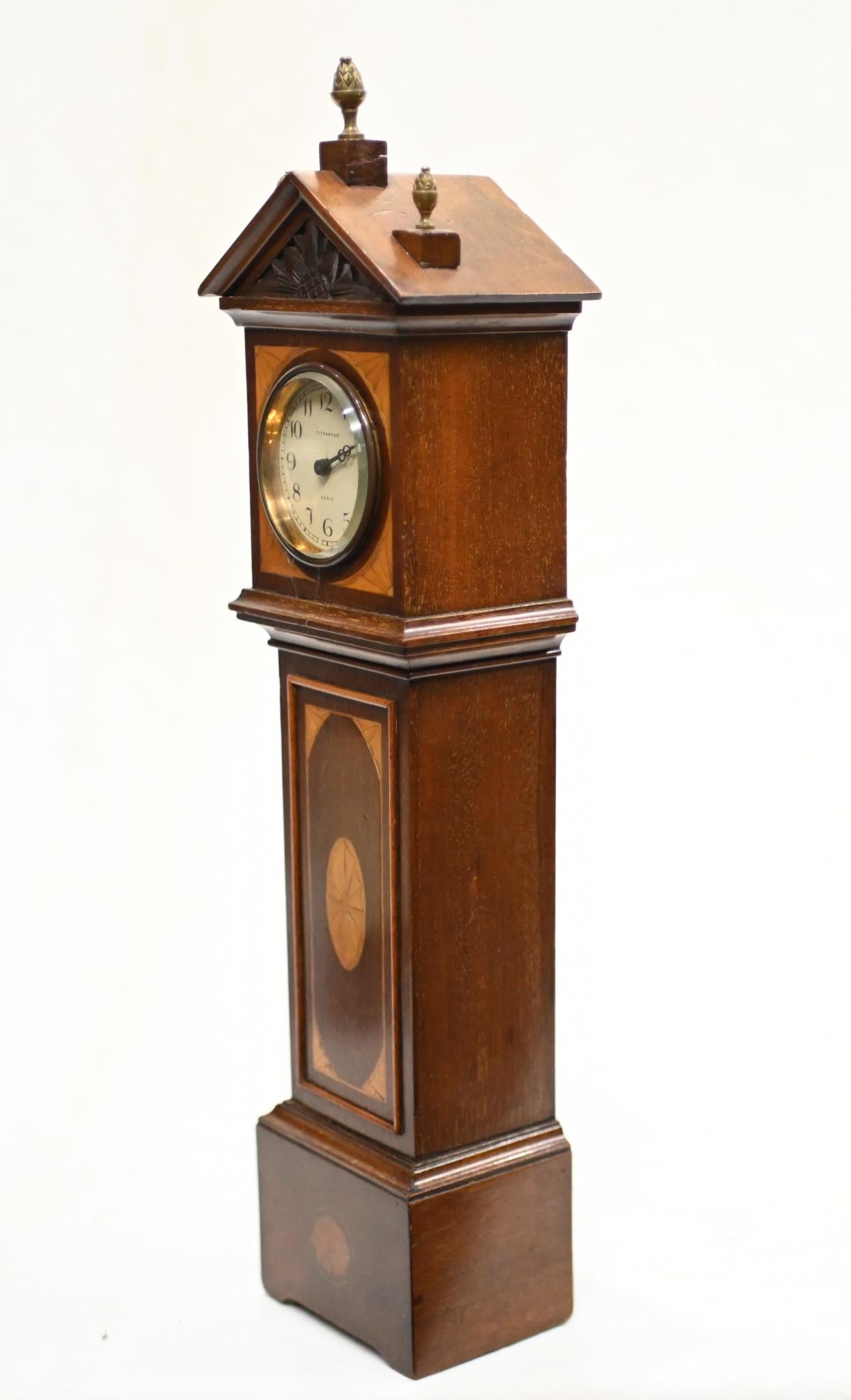 Gorgeous mini Grandfather clock in the Sheraton manner
Circa 1890 on this small apprentice piece
Mahogany with satinwood inlays including shell motifs
Offered in great shape and will ship to anywhere in the world
Please contact us for a shipping